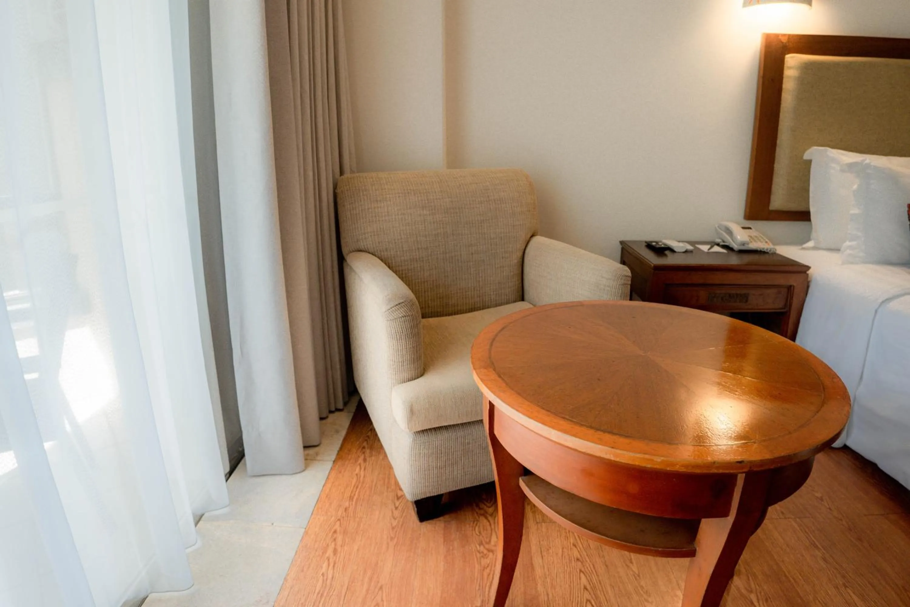 Seating area, Bed in Kuta Paradiso Hotel