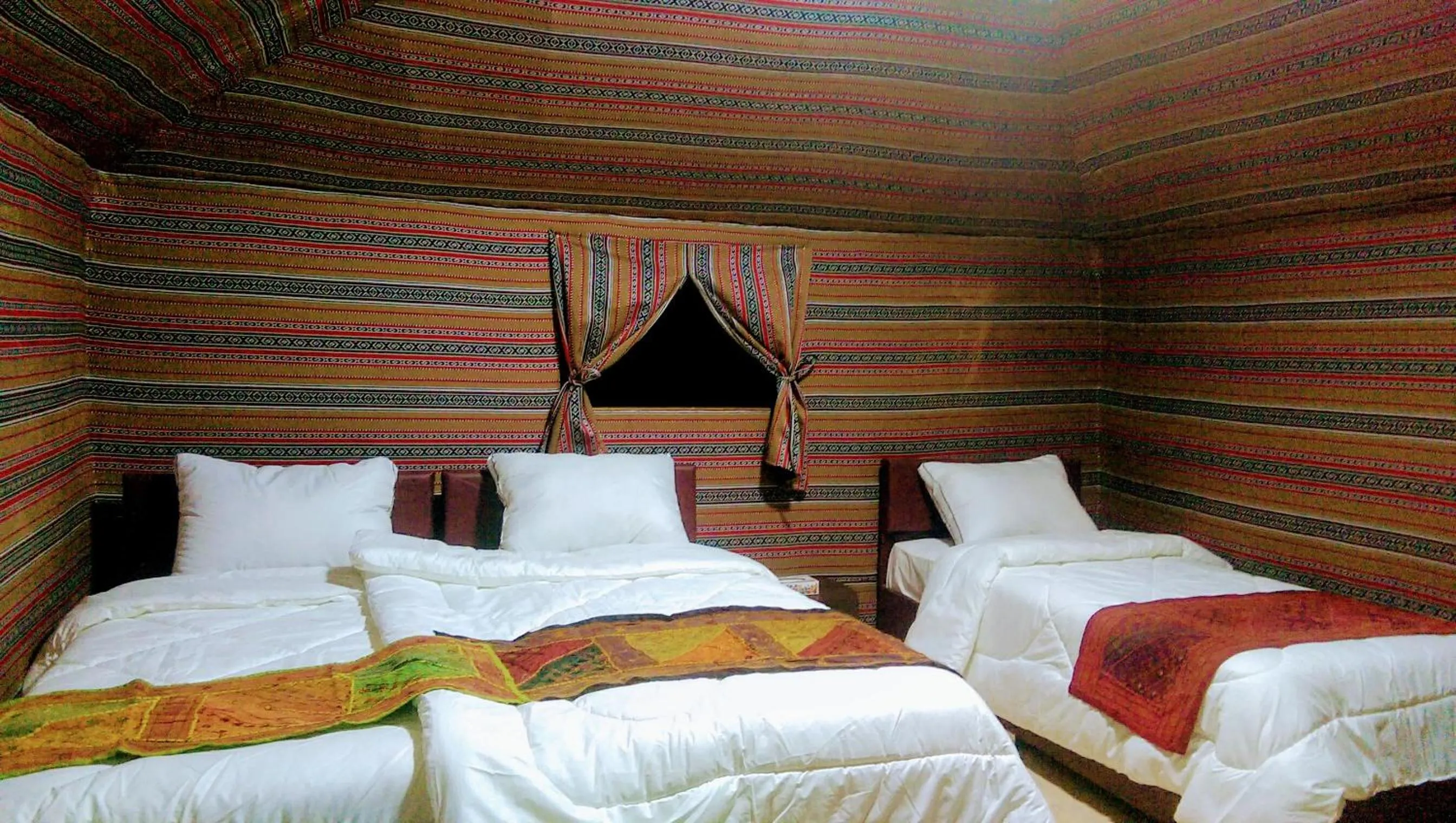 Bed in Beyond Wadi Rum Camp
