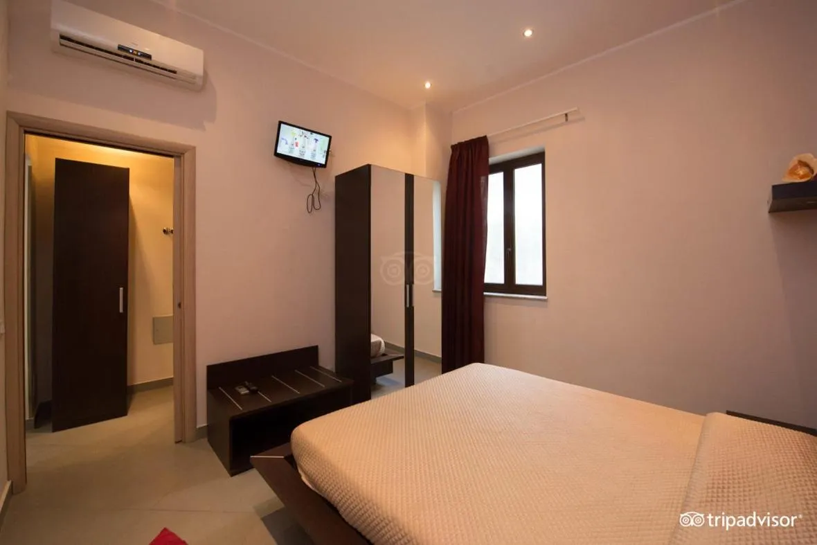 Photo of the whole room, Bed in Palazzo Dei Corsari