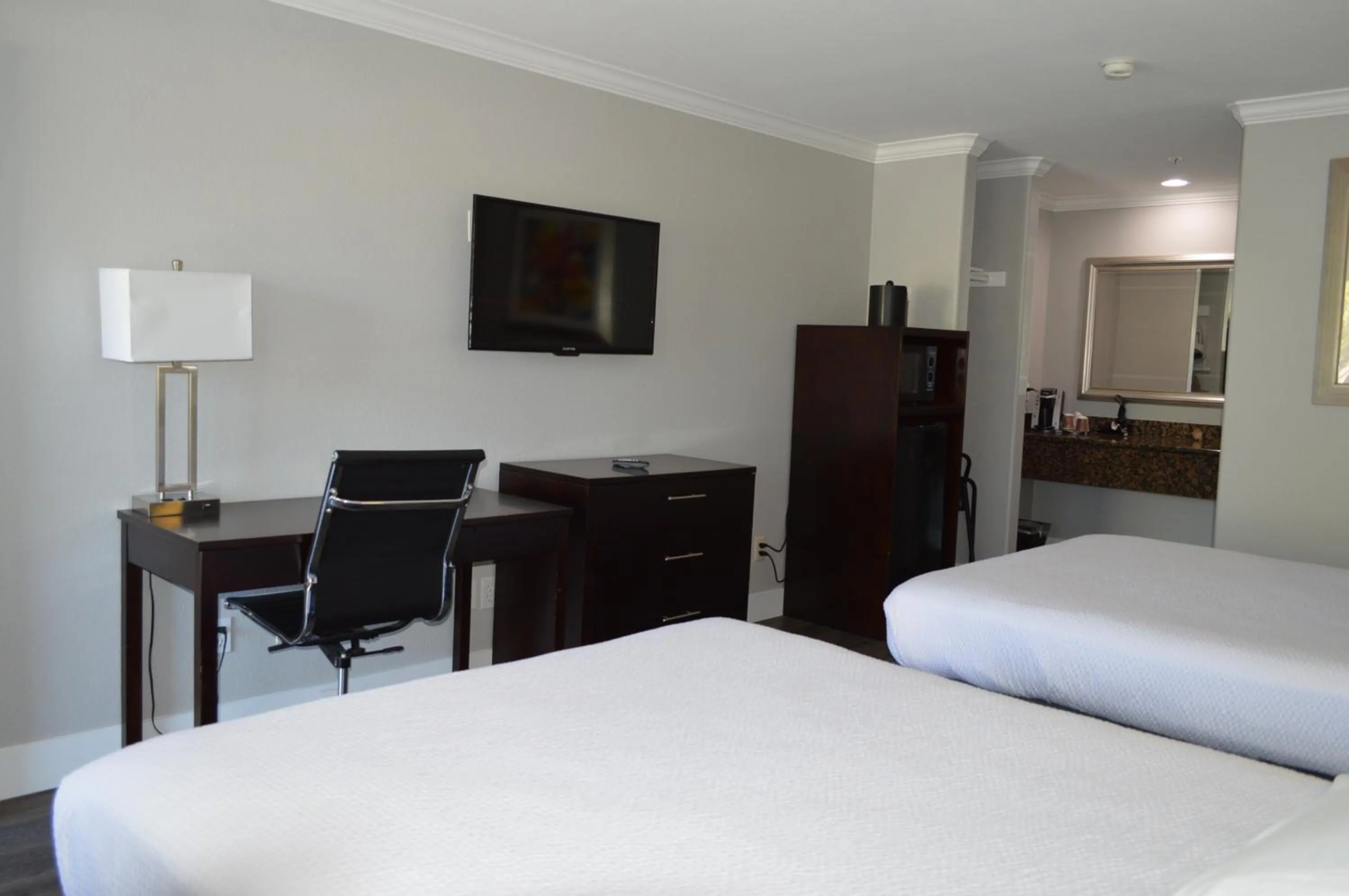 Bed in Fairview Inn & Suites