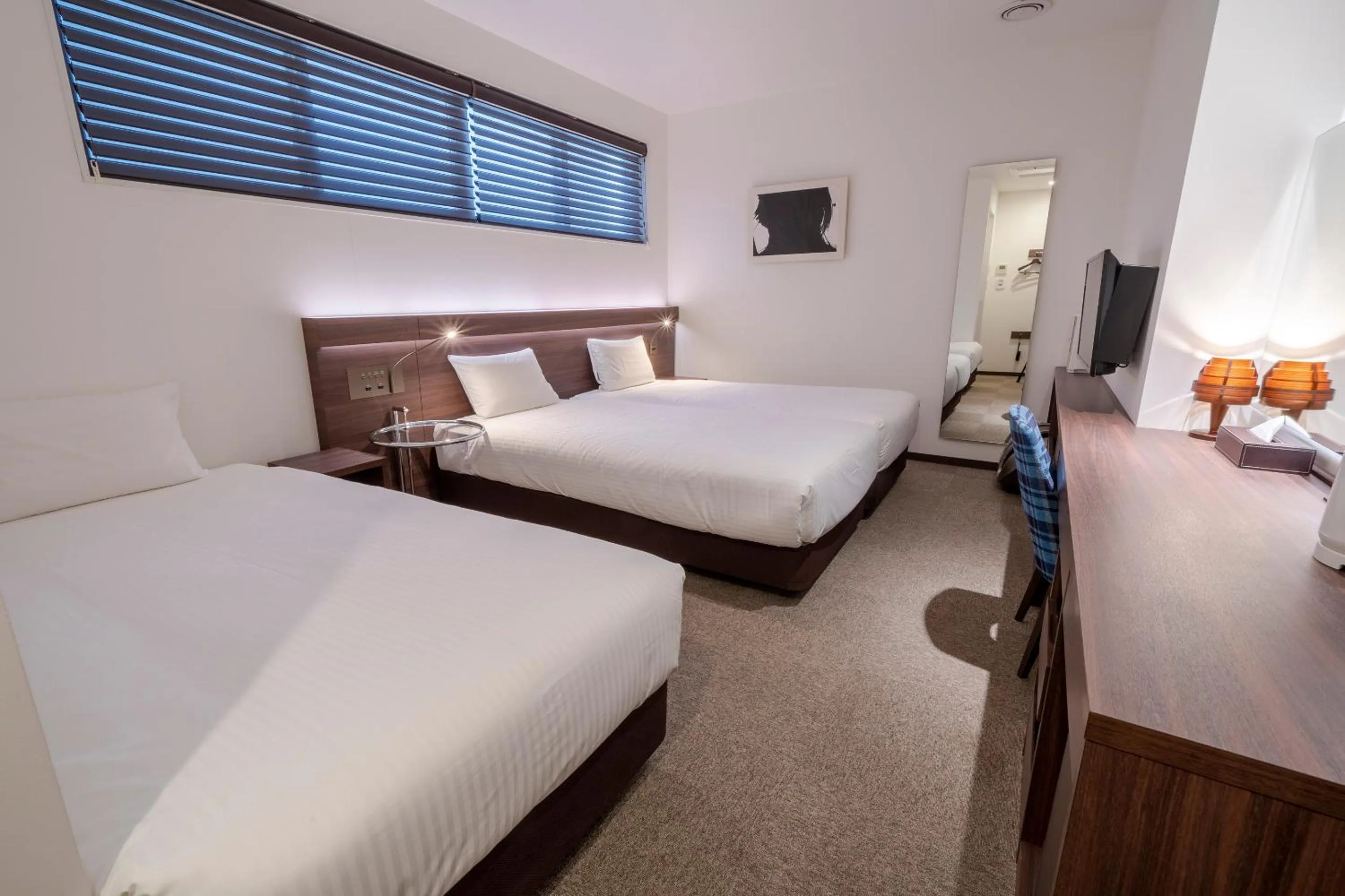 Bed in RESI STAY Jisco Hotel Kyoto Goshonishi