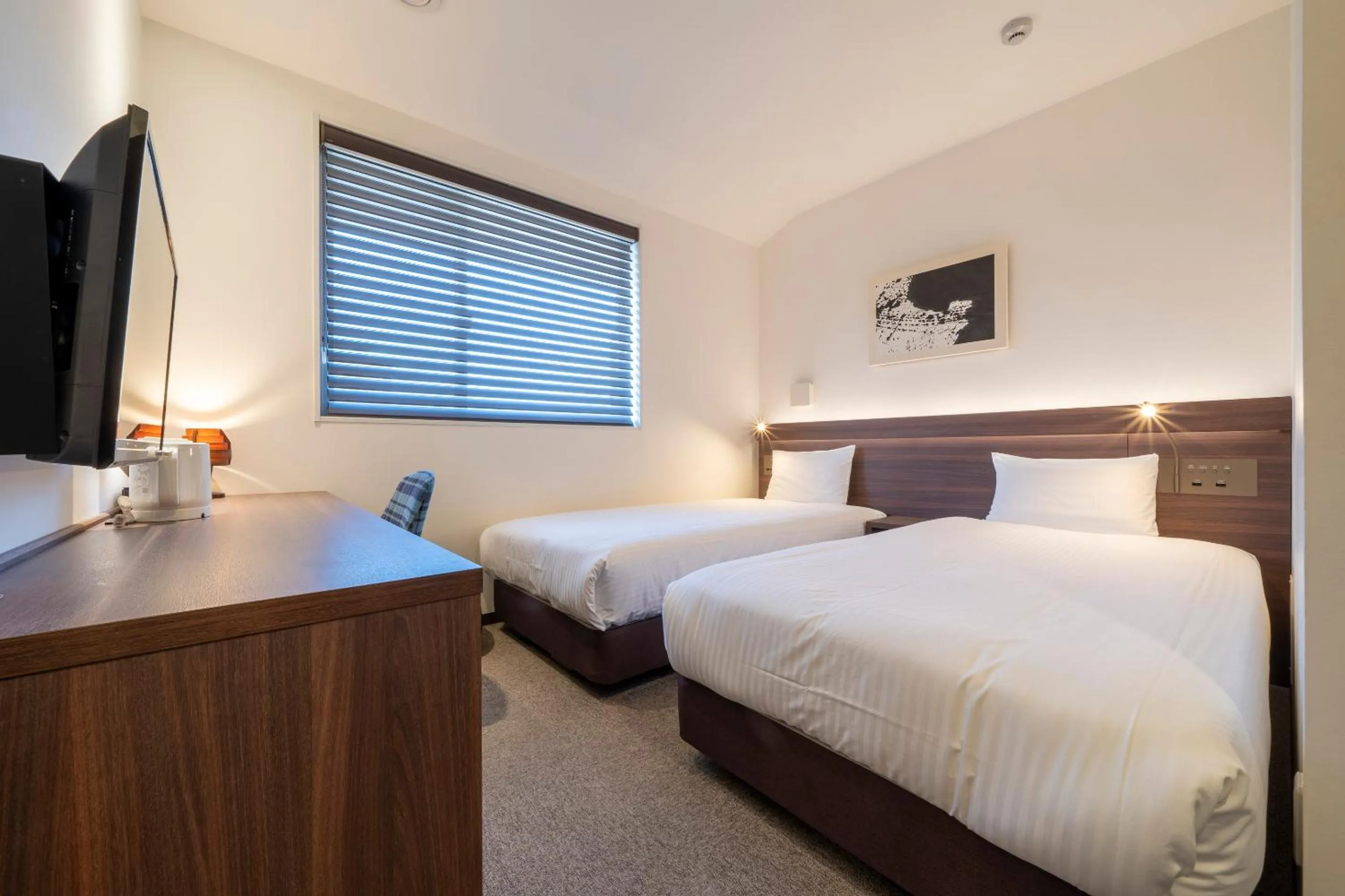 Bed in RESI STAY Jisco Hotel Kyoto Goshonishi