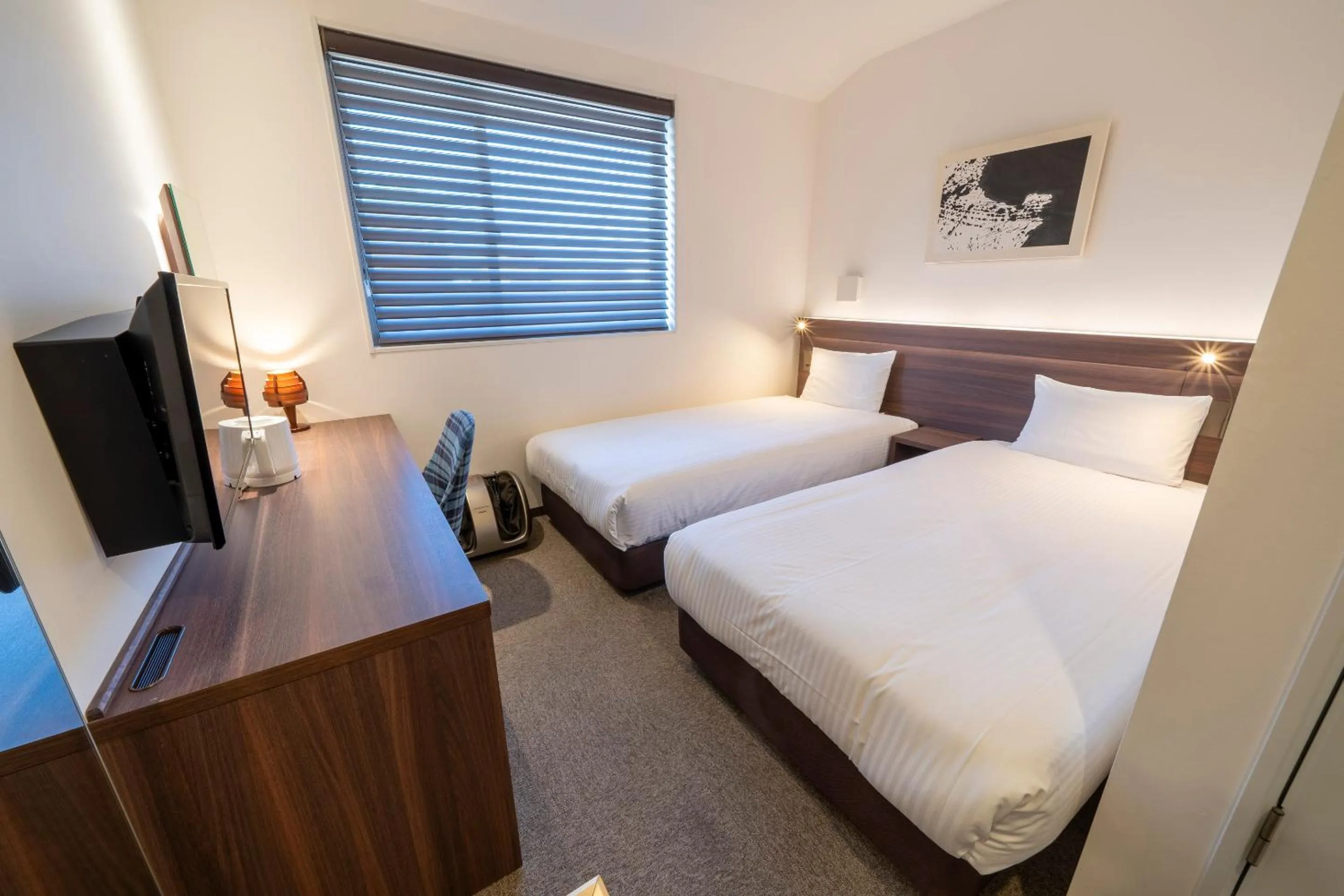 Bed in RESI STAY Jisco Hotel Kyoto Goshonishi