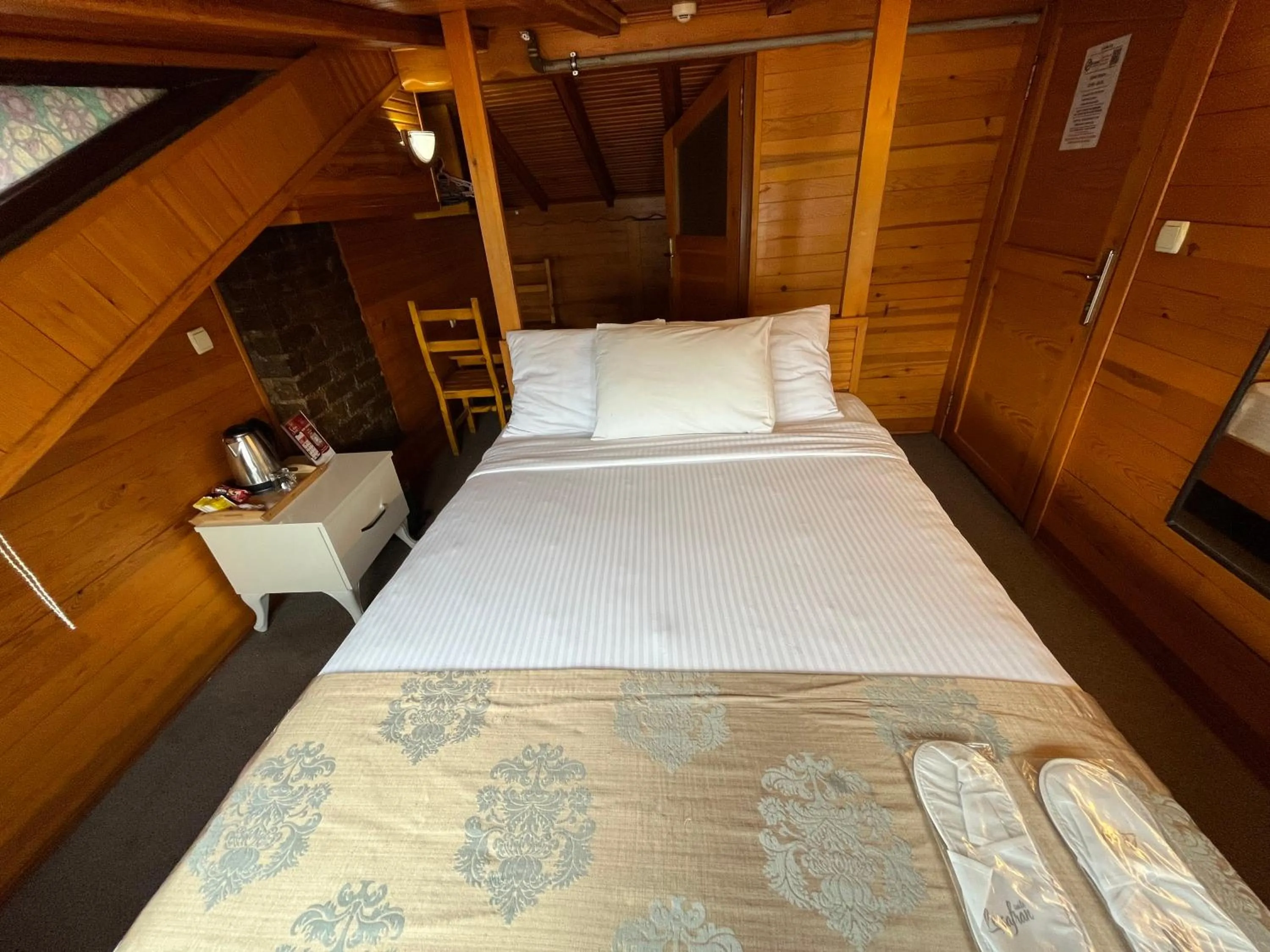 Bed in Le Safran Suite Hotel