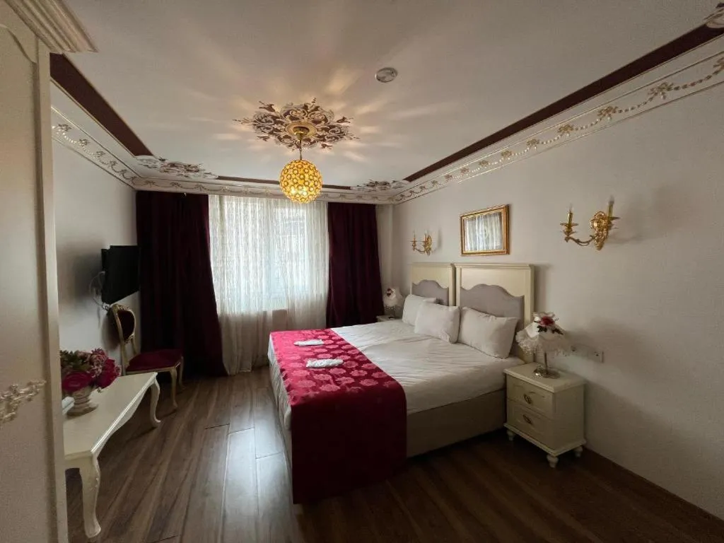 Bed in Le Safran Suite Hotel