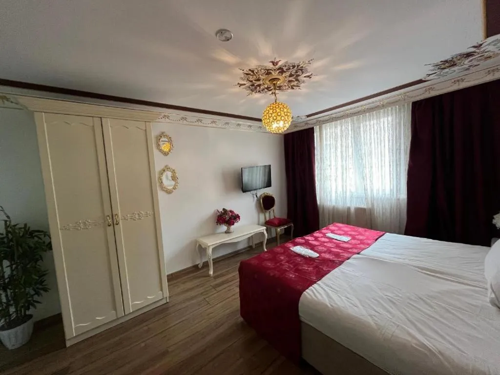 Bed in Le Safran Suite Hotel