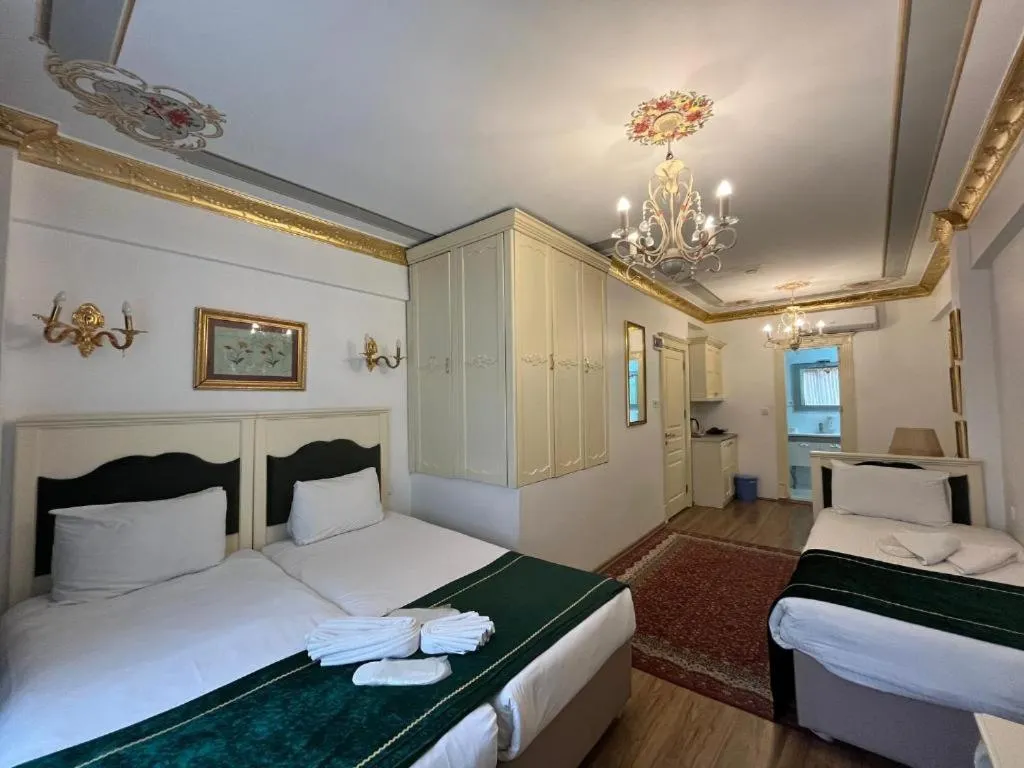 Bed in Le Safran Suite Hotel