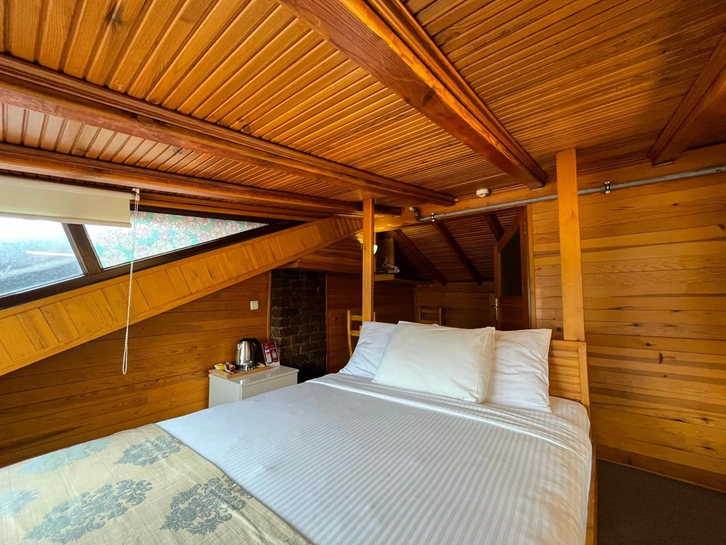 Bed in Le Safran Suite Hotel