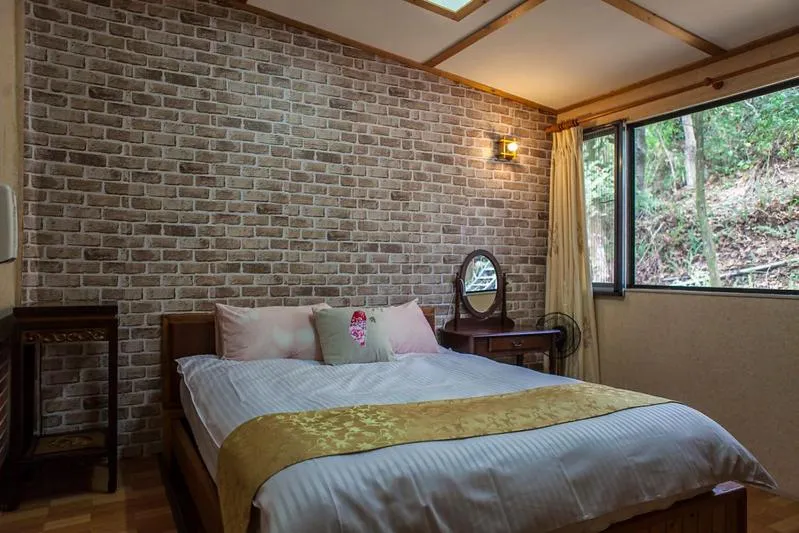 Bed in Shan Shui-Yuan Vege Guest House