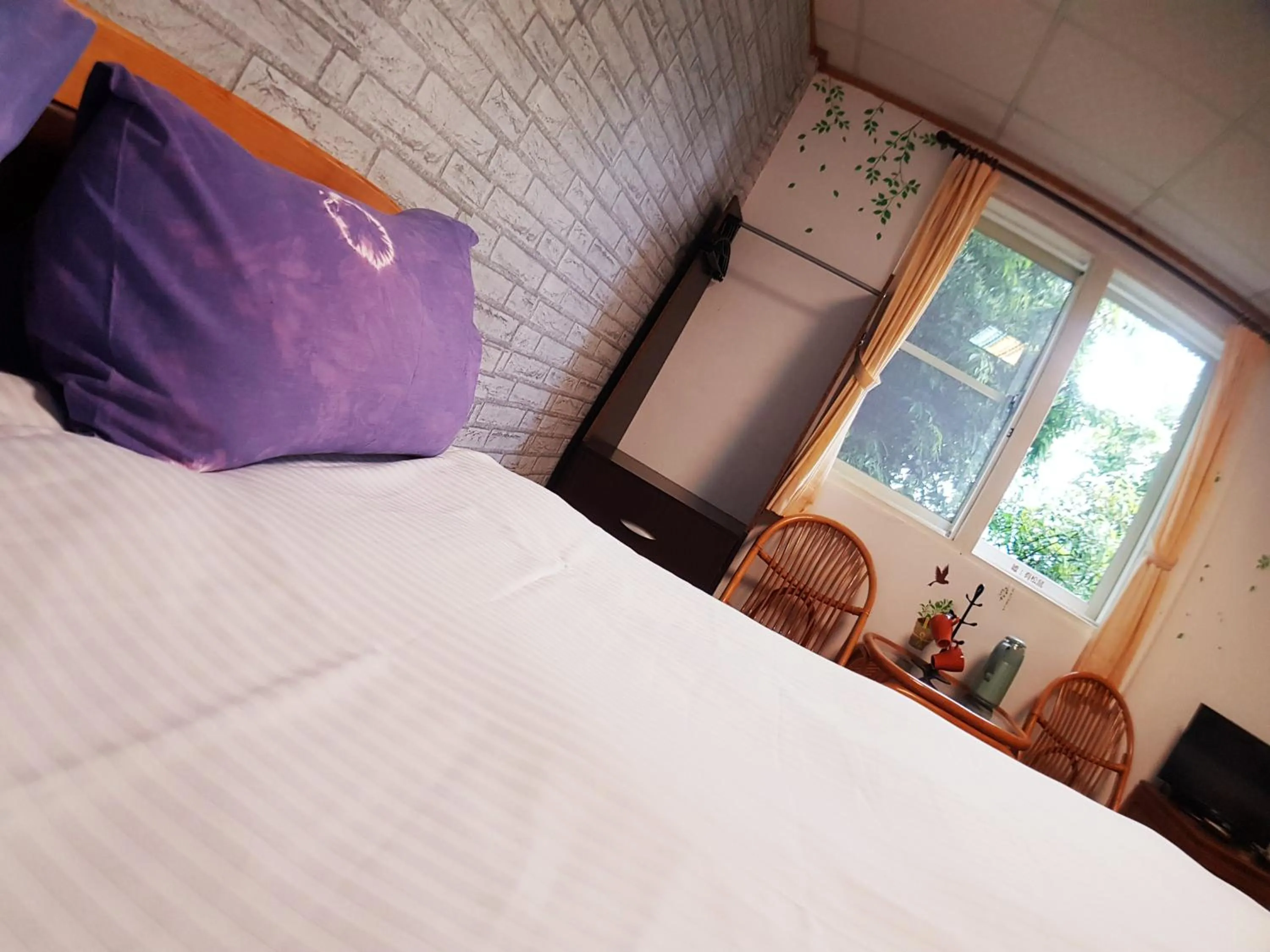 Bed in Shan Shui-Yuan Vege Guest House