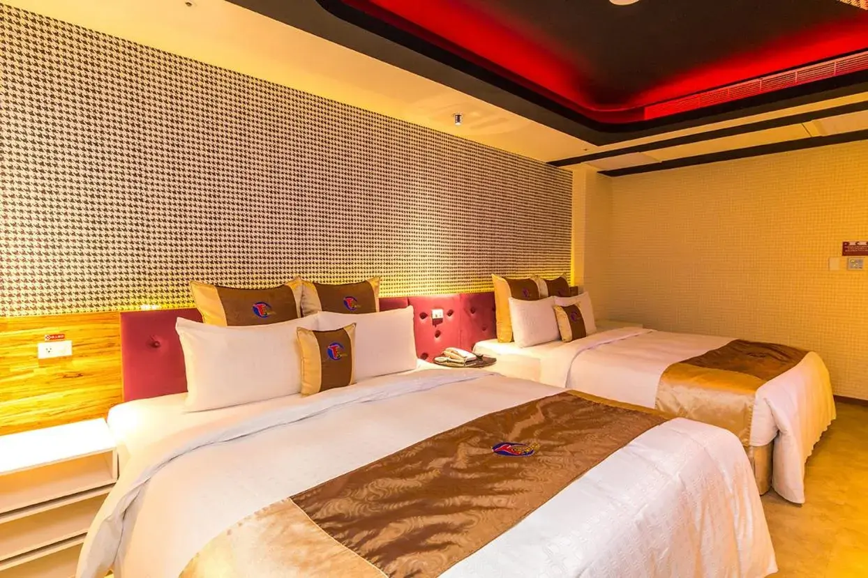 Bed in Ting-Shuai Motel Bed in Ting-Shuai Motel