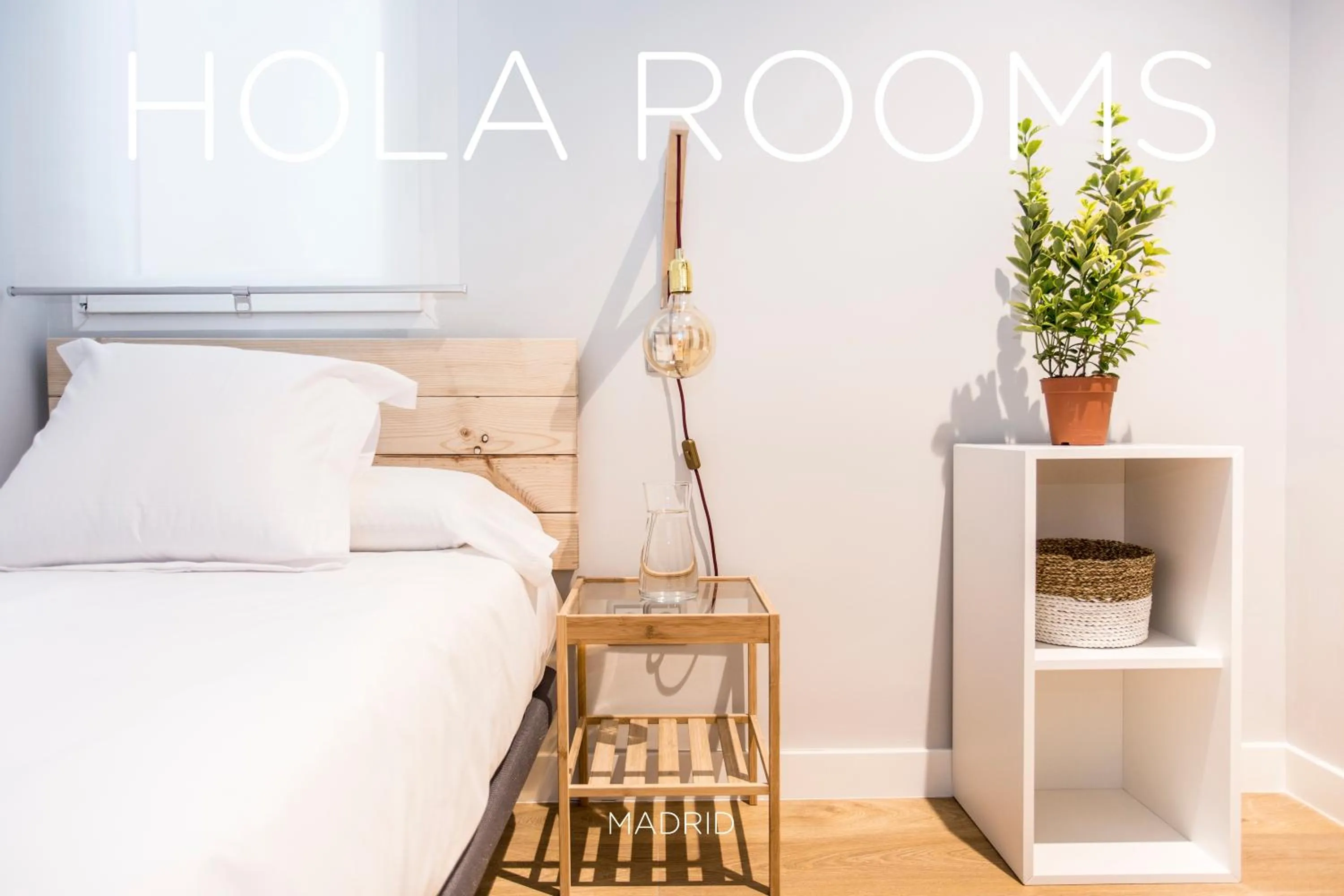 Bed in Hola Rooms