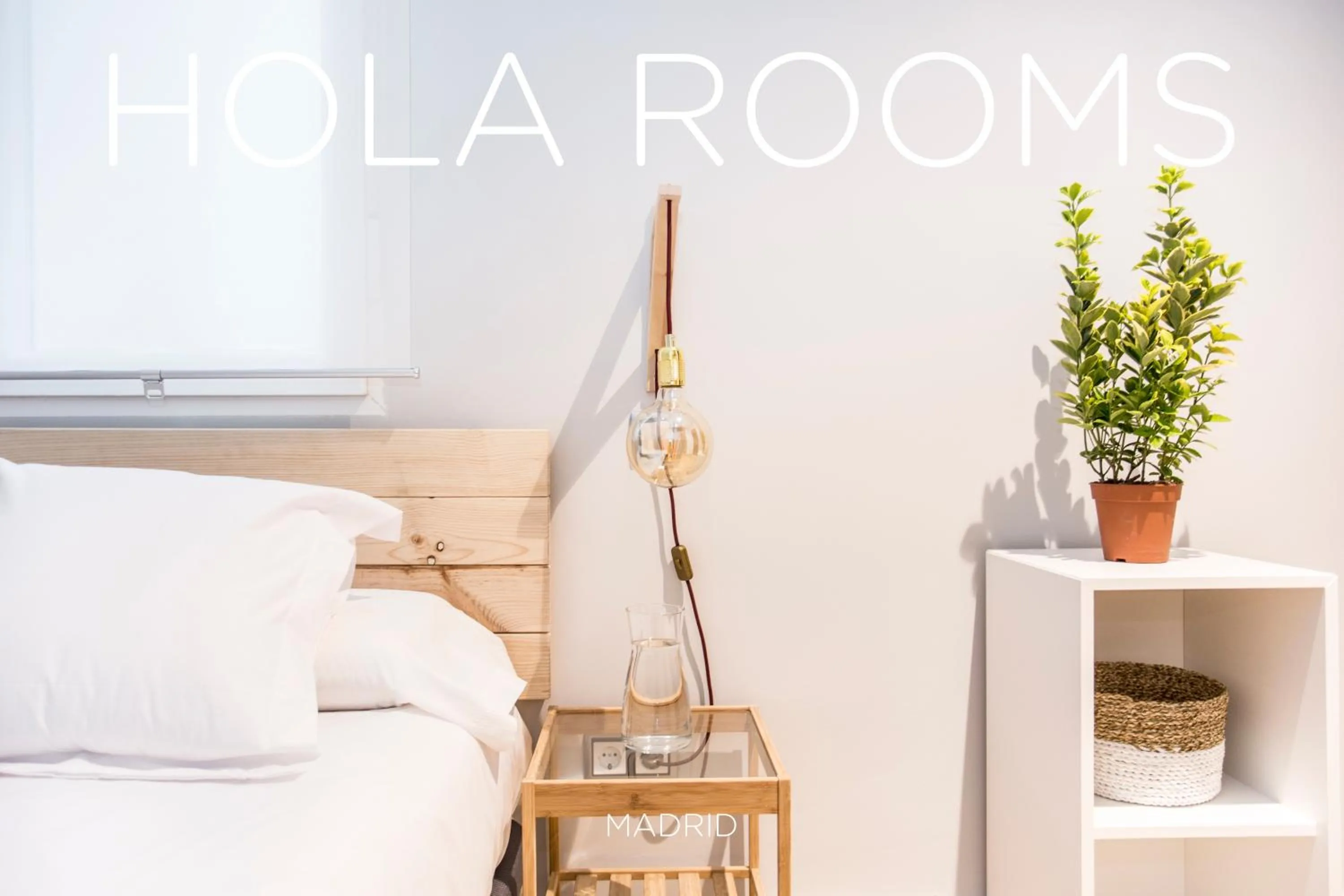 Bed in Hola Rooms