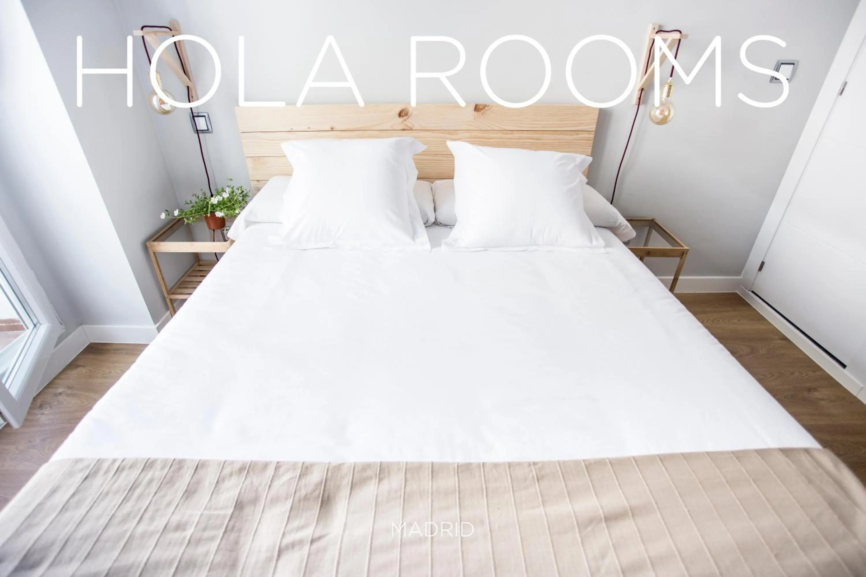 Bed in Hola Rooms