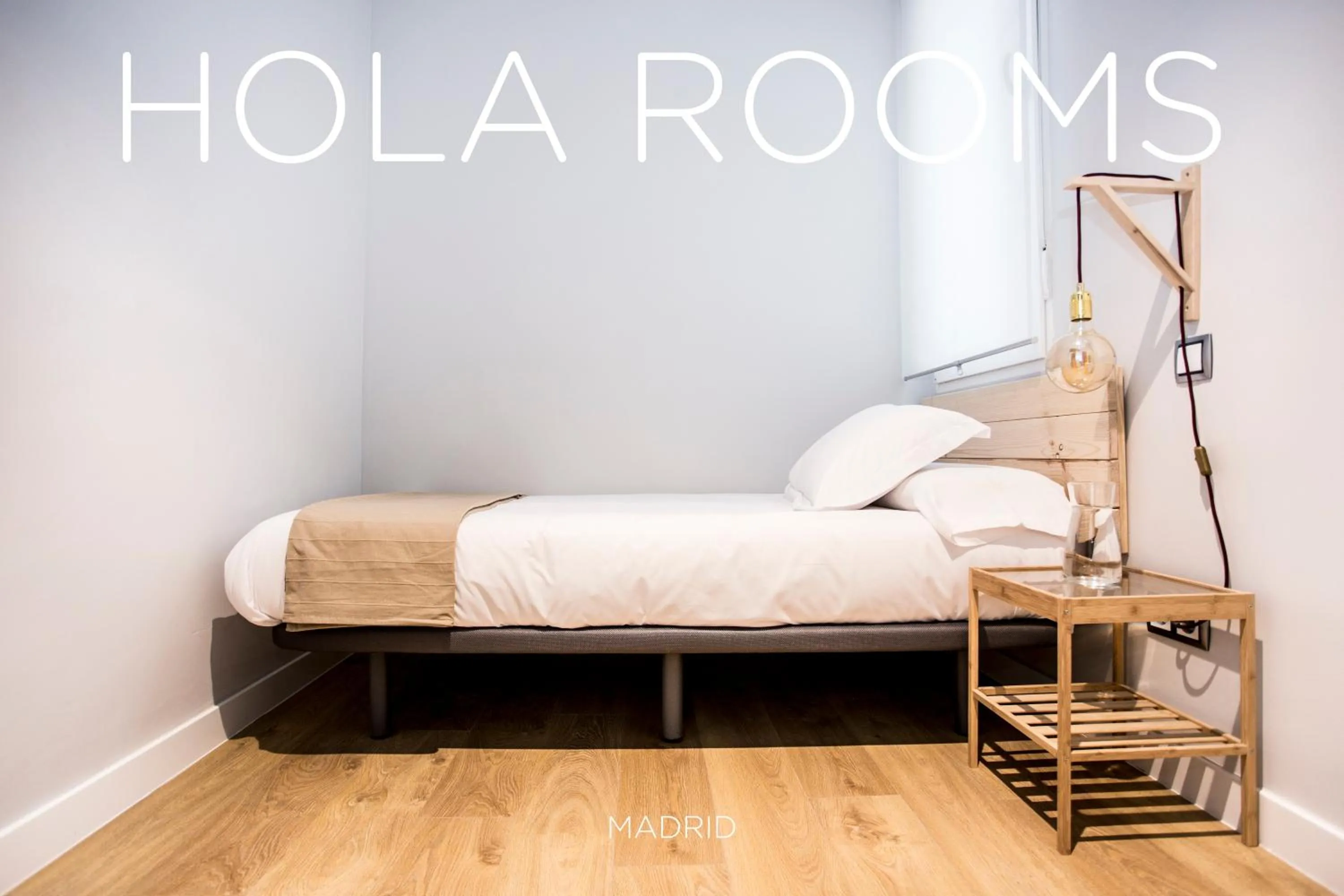 Bed in Hola Rooms