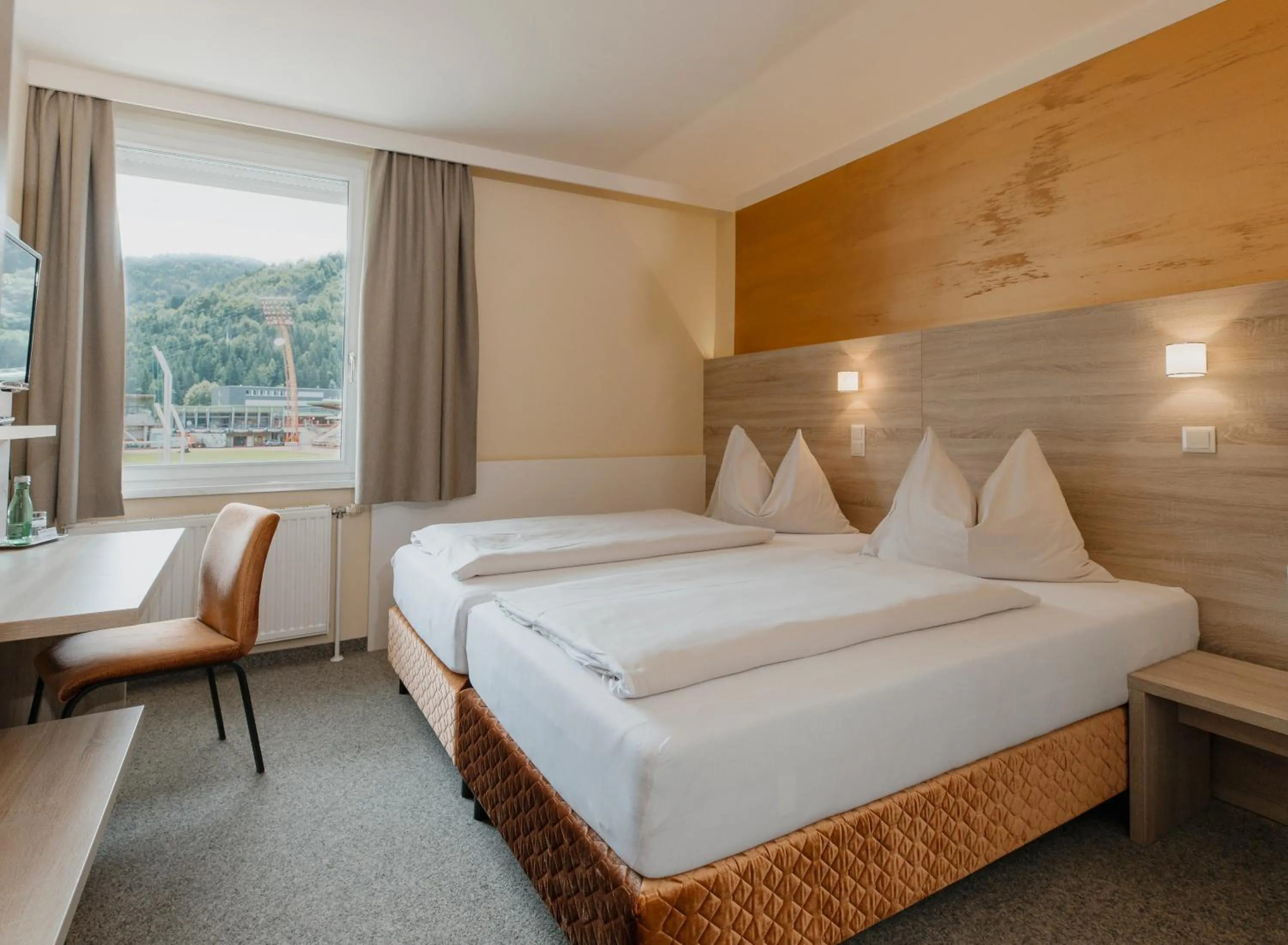 Photo of the whole room, Bed in Sporthotel Kapfenberg