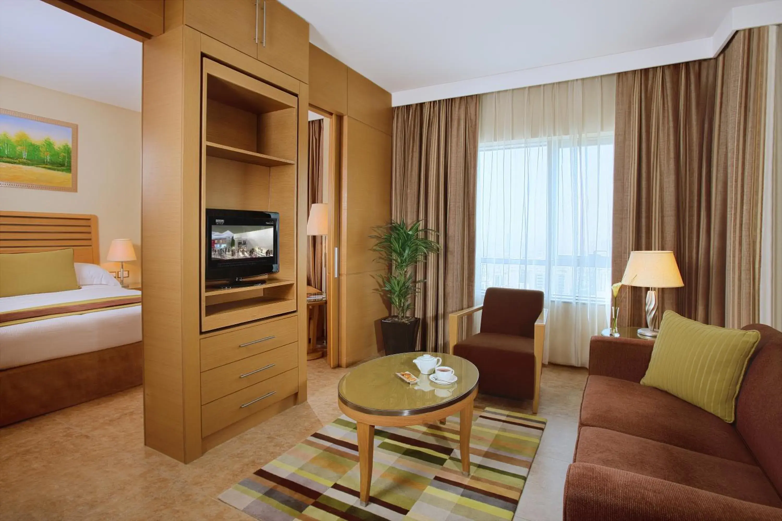 Seating area, Bed in Nour Arjaan by Rotana-Fujairah Seating area, Bed in Nour Arjaan by Rotana-Fujairah