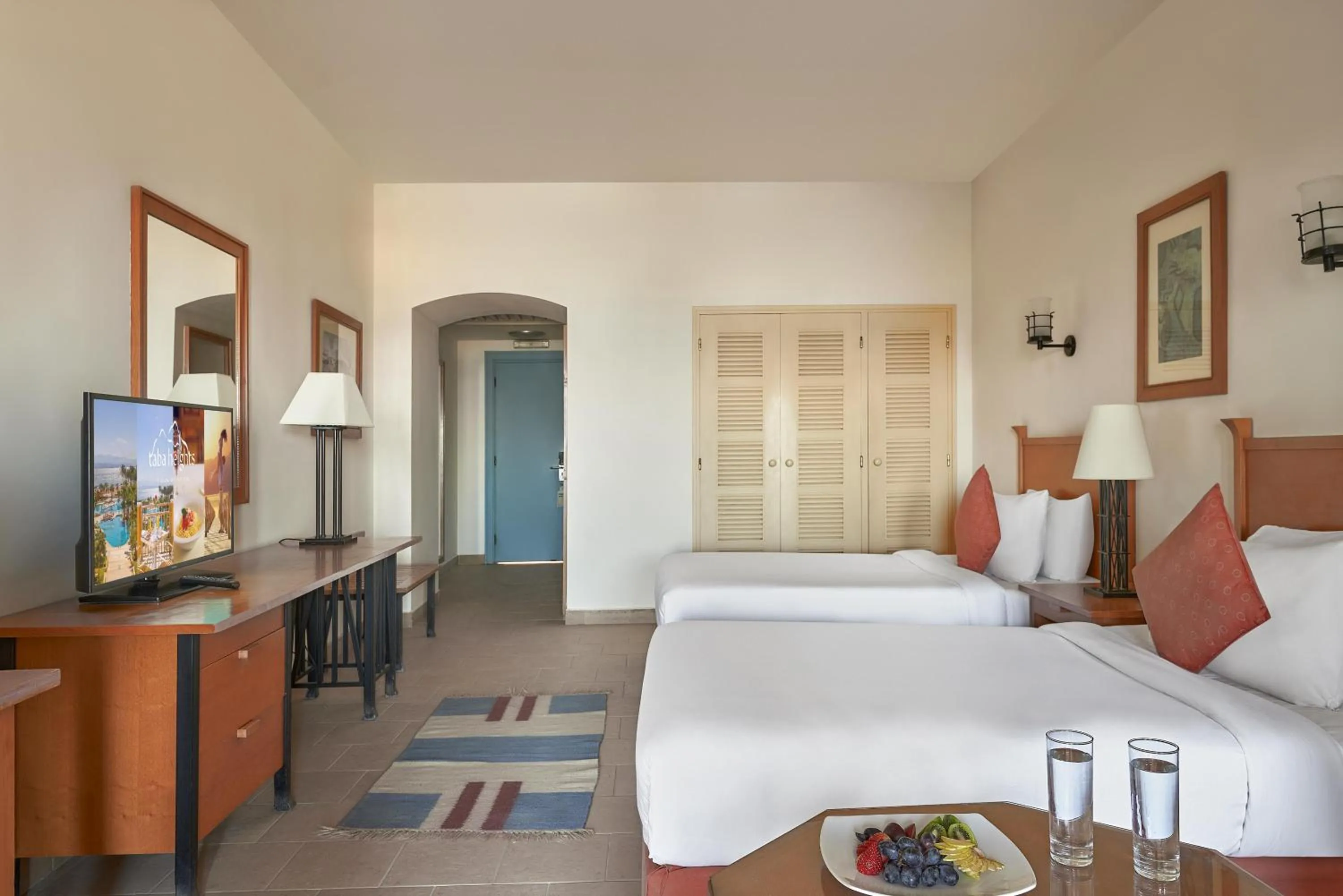 Photo of the whole room, Bed in Strand Beach Resort