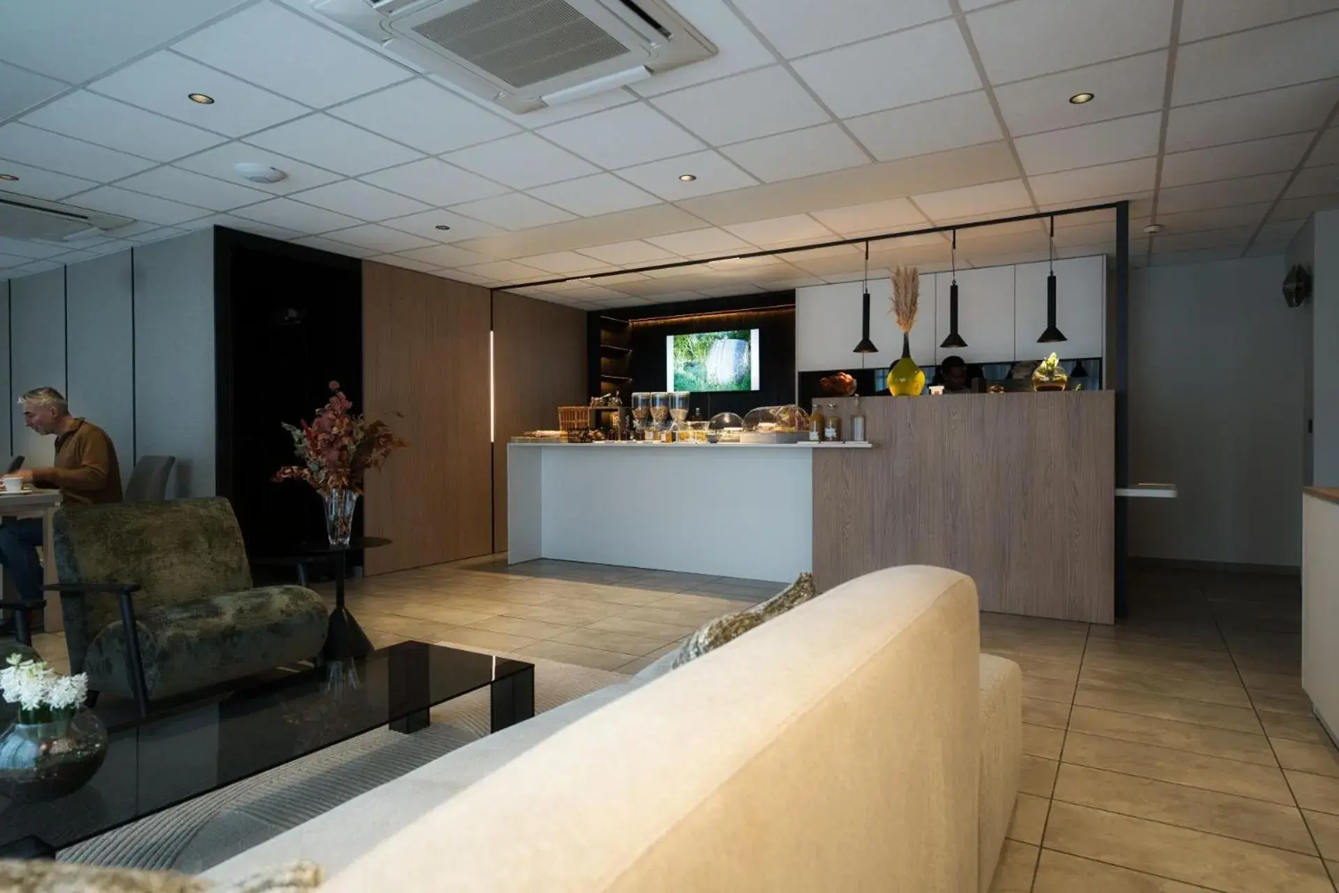 Living room in Logis Restaurant & Hôtel À la 12 Living room in Logis Restaurant & Hôtel À la 12