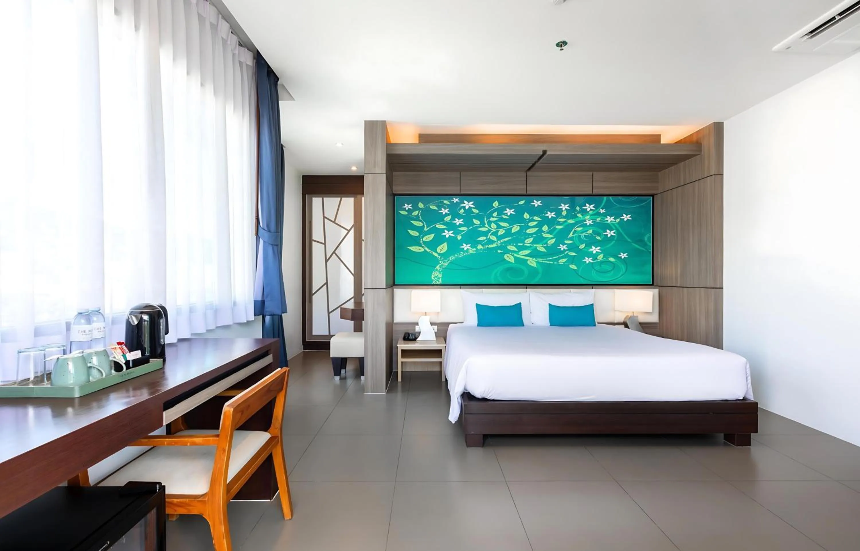 Photo of the whole room, Bed in The Marina Phuket Hotel