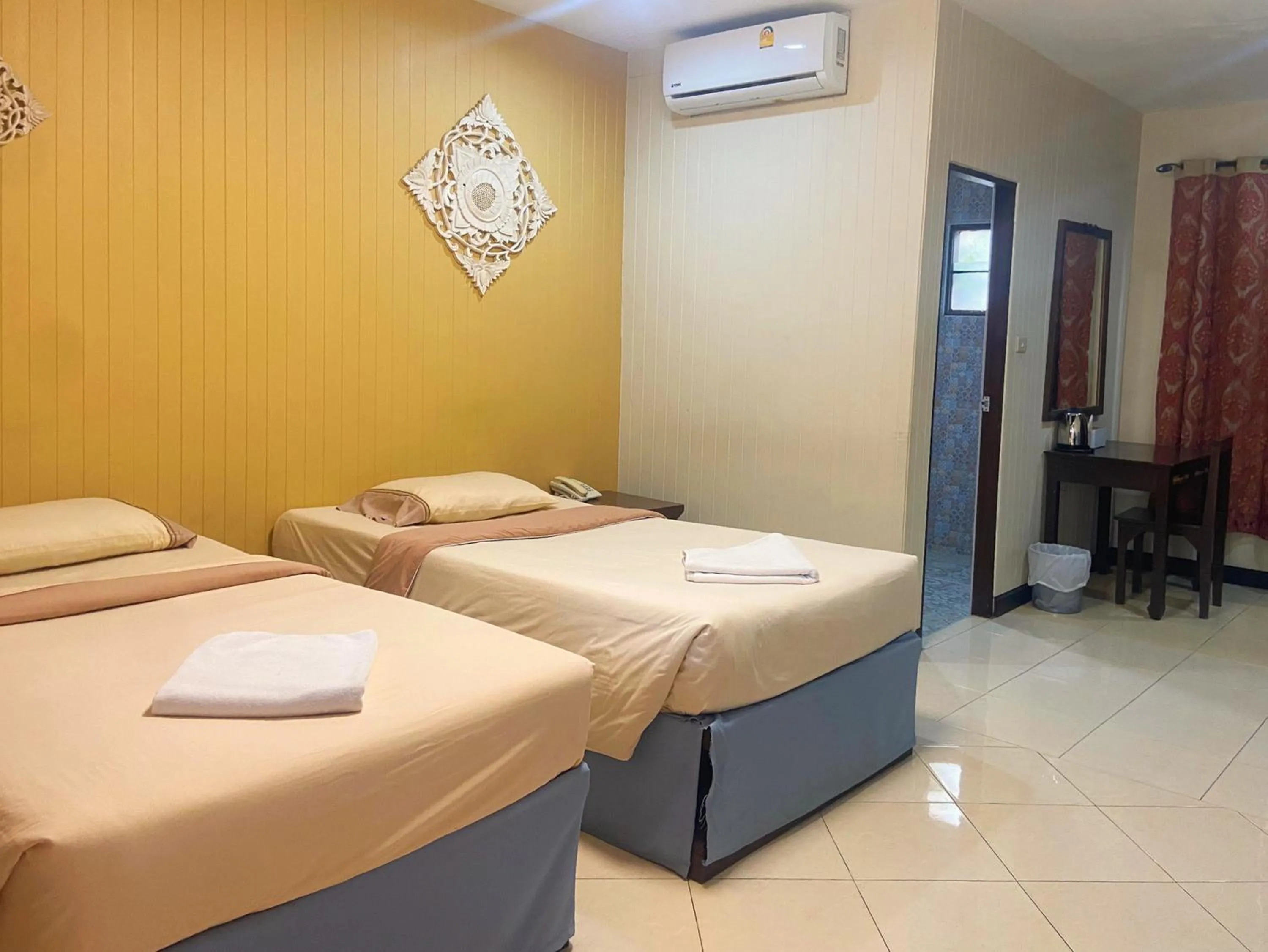 Bed in Kasalong Resort and Spa Pattaya