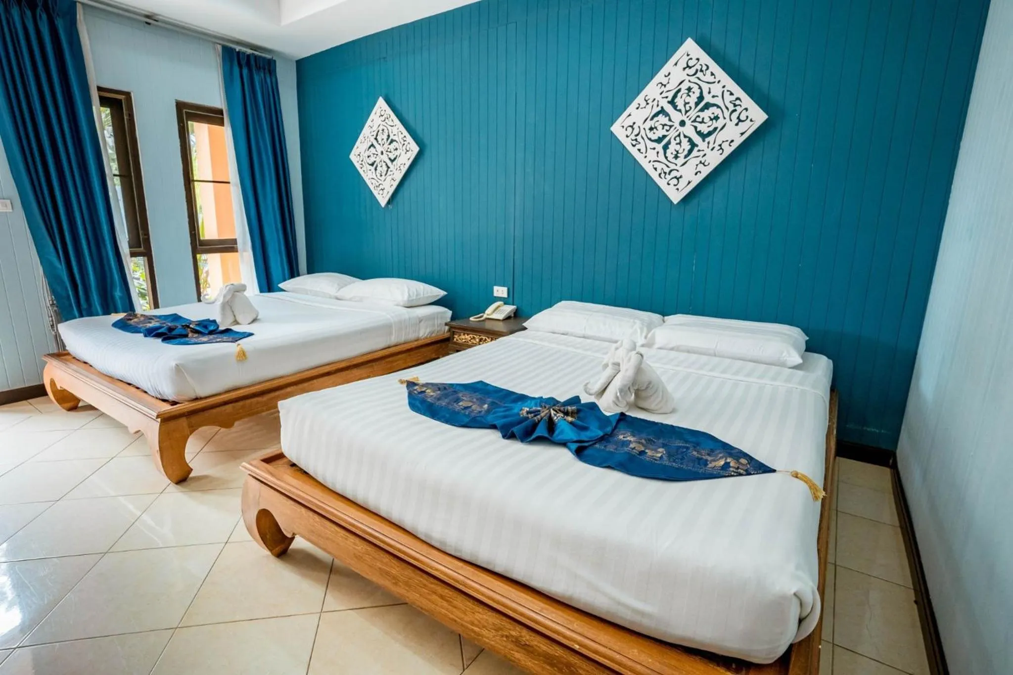 Bed in Kasalong Resort and Spa Pattaya
