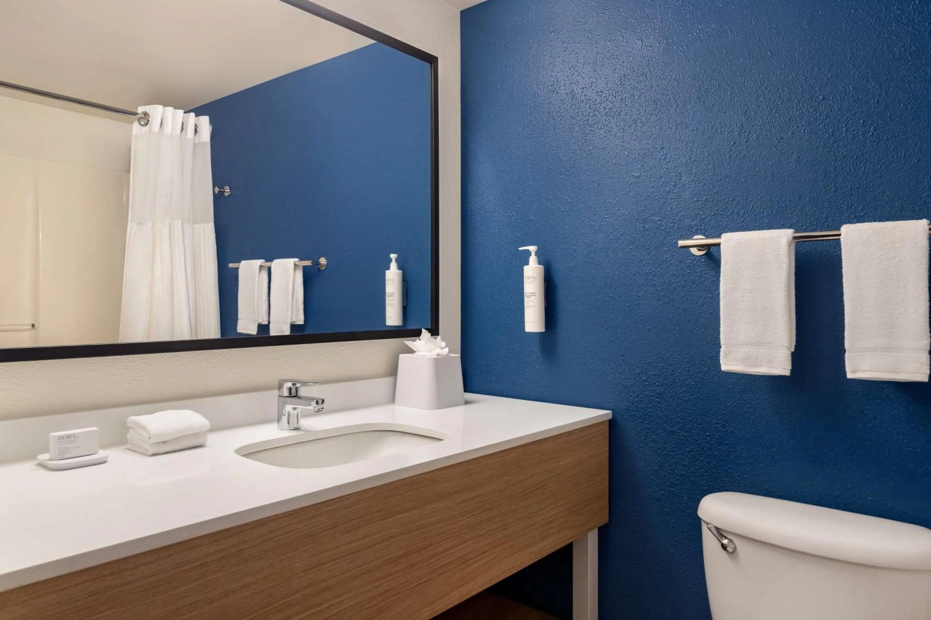 Bathroom in Spark by Hilton Orlando Universal Boulevard