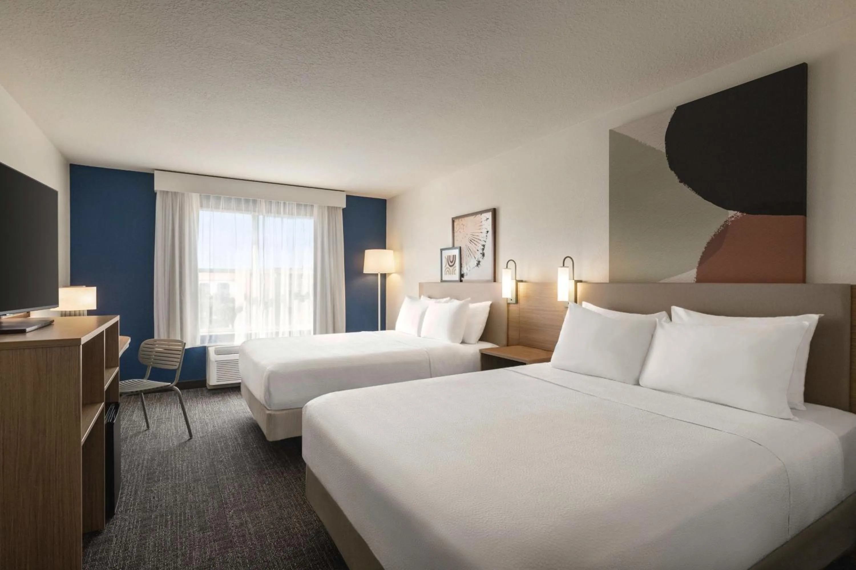 Bed in Spark by Hilton Orlando Universal Boulevard