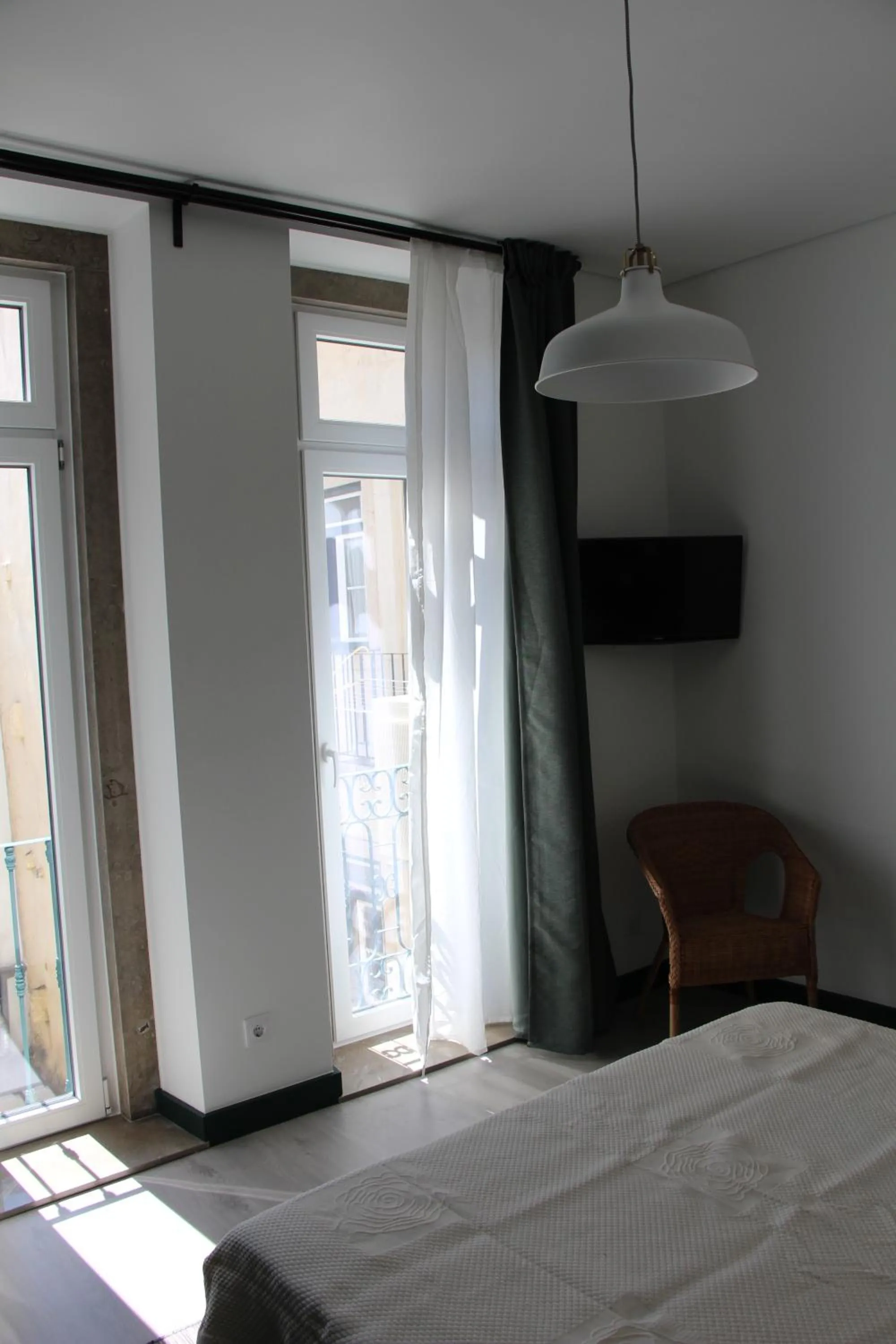 Bed in DoBairro suites at Bairro Alto