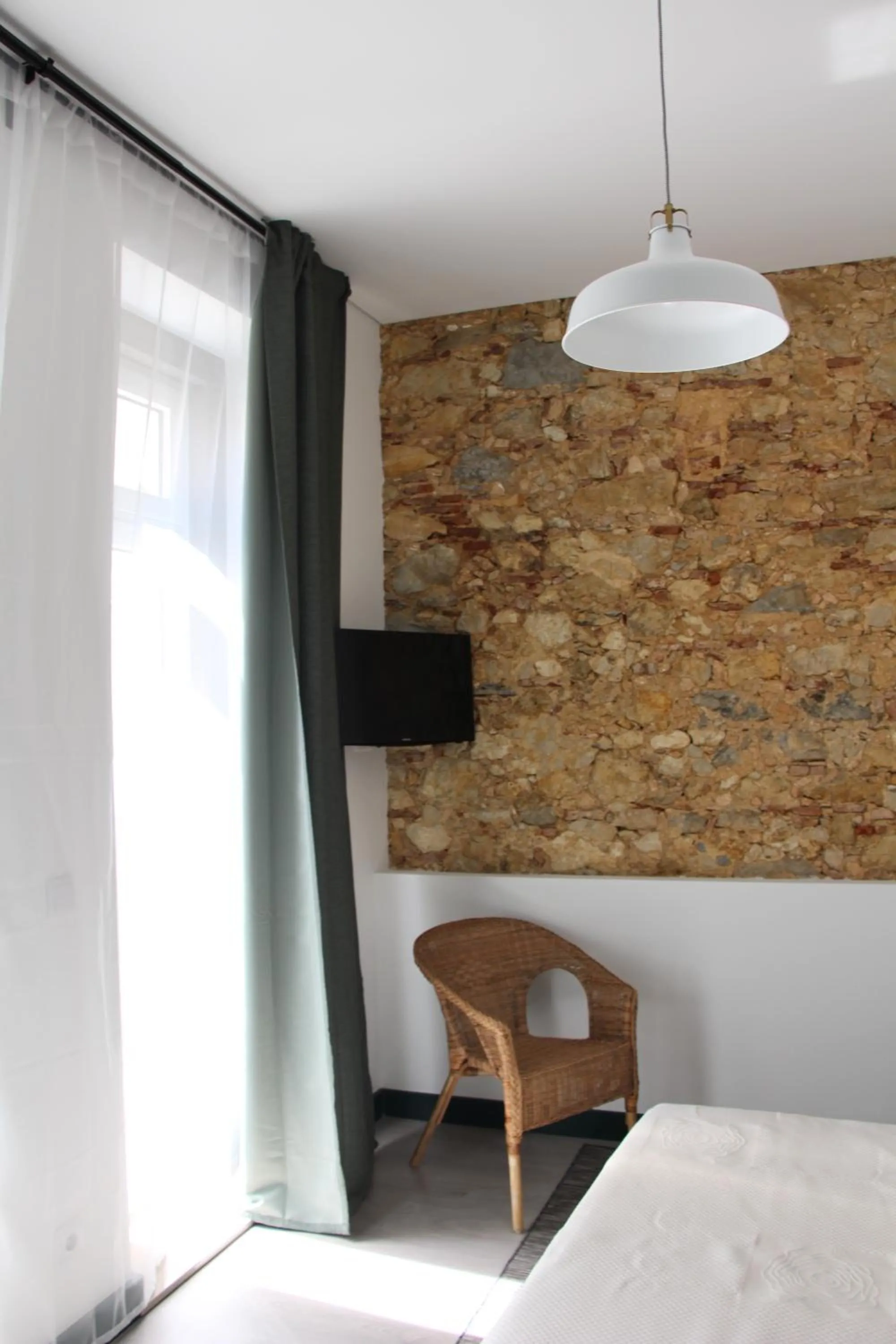 Bed in DoBairro suites at Bairro Alto