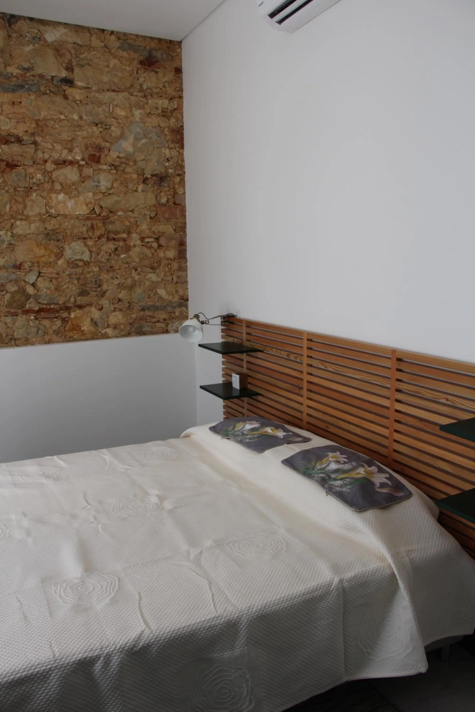 Bed in DoBairro suites at Bairro Alto