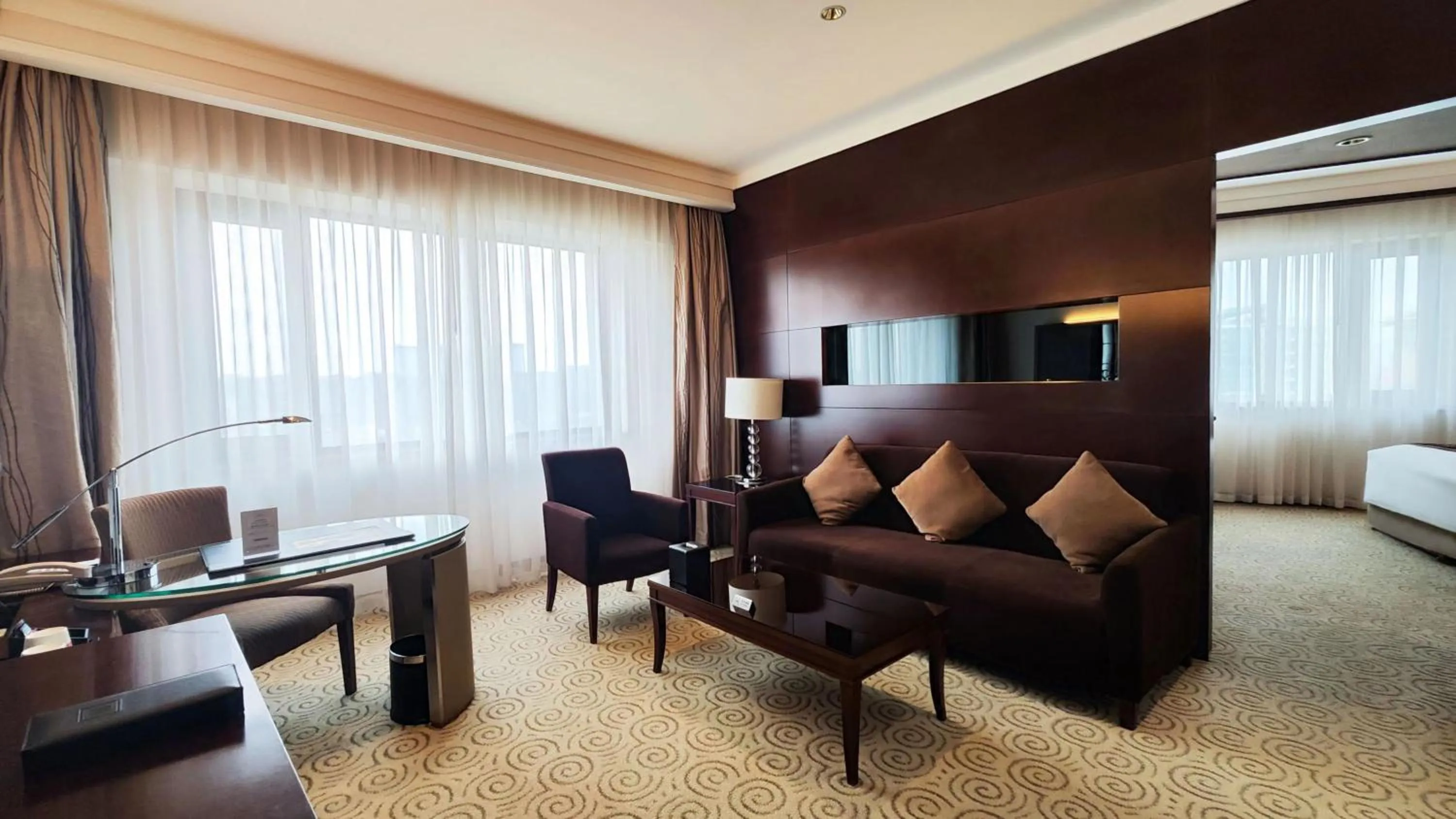 Living room, Bed in Millennium Hotel Chengdu