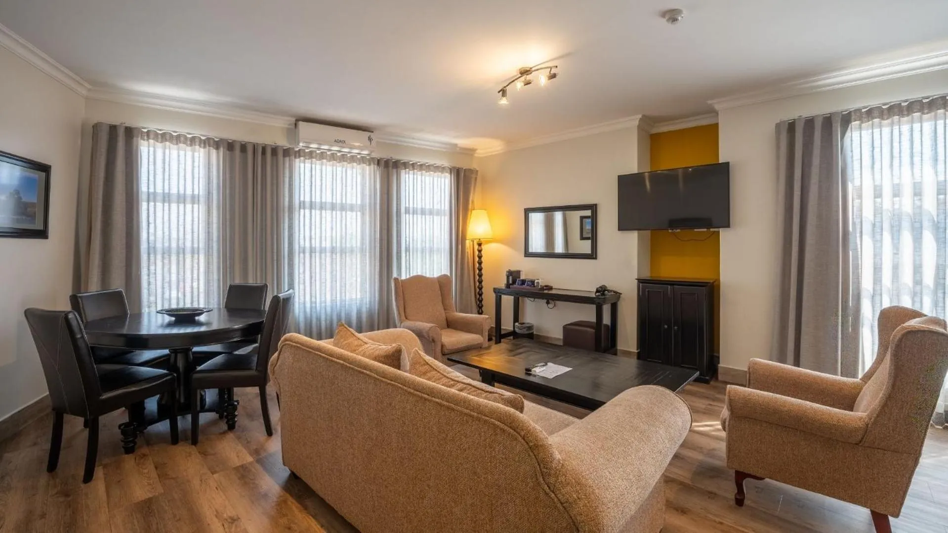 Communal lounge/ TV room in ANEW Hotel Highveld Emalahleni