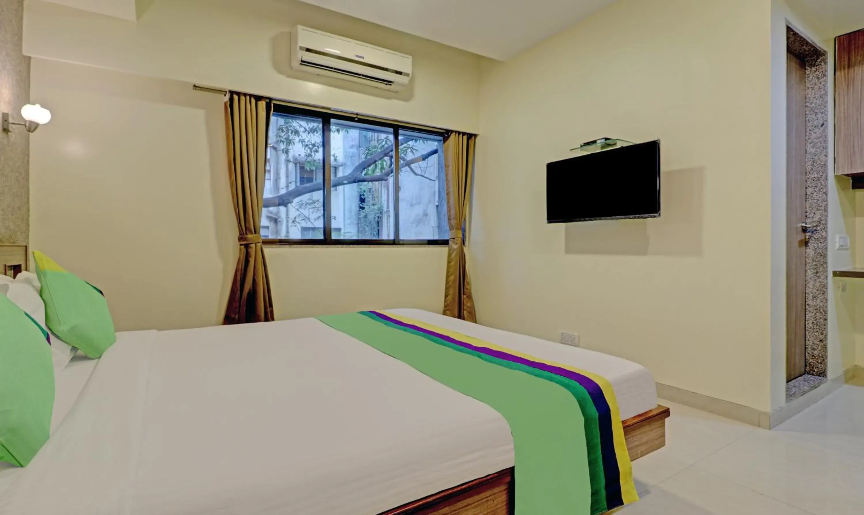 Bedroom, Bed in Treebo Vikrant Residency Bedroom, Bed in Treebo Vikrant Residency