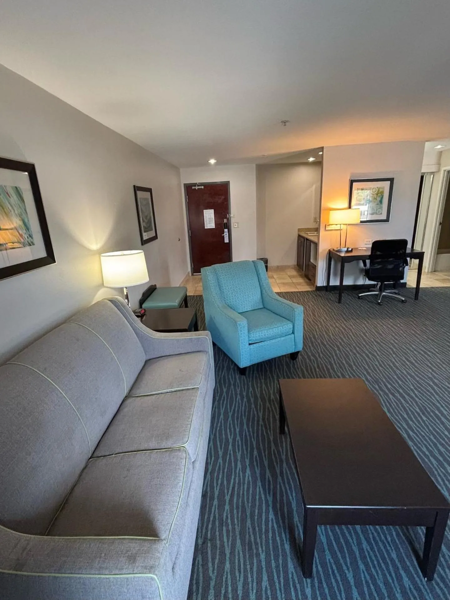 Living room in Ramada by Wyndham Burkburnett - Wichita Falls