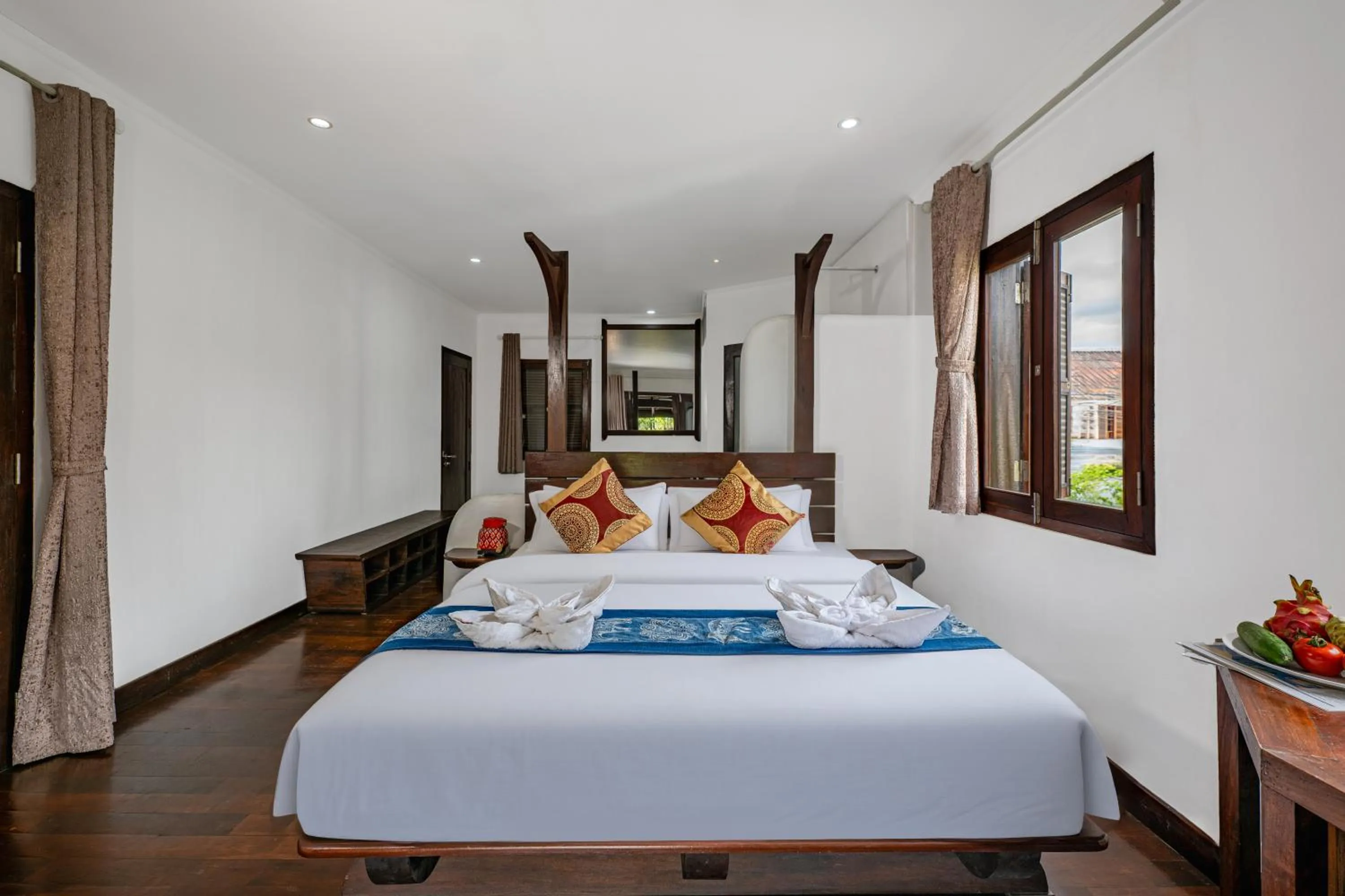 Bed in Ancient Luangprabang Hotel