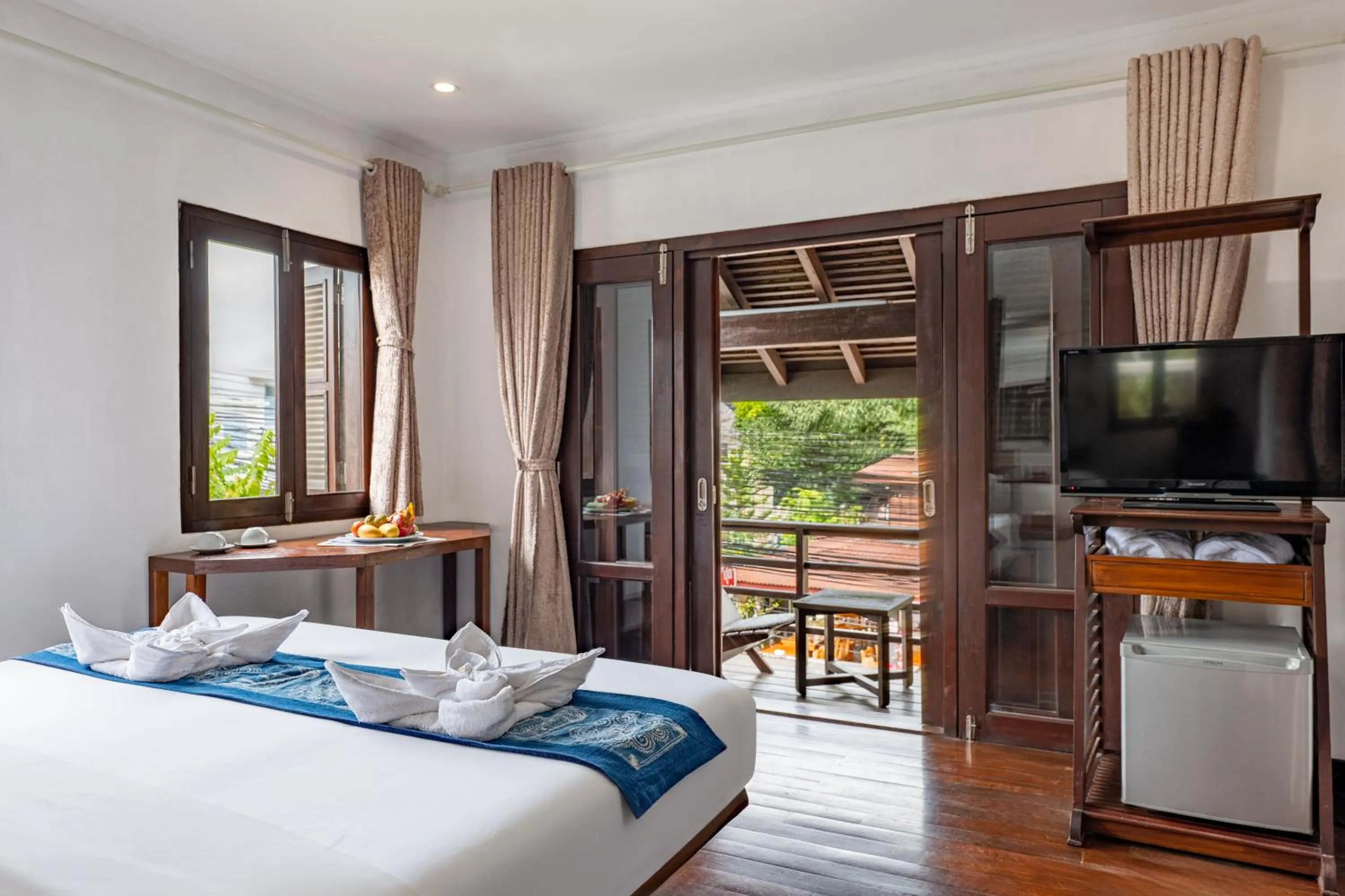 Bed in Ancient Luangprabang Hotel