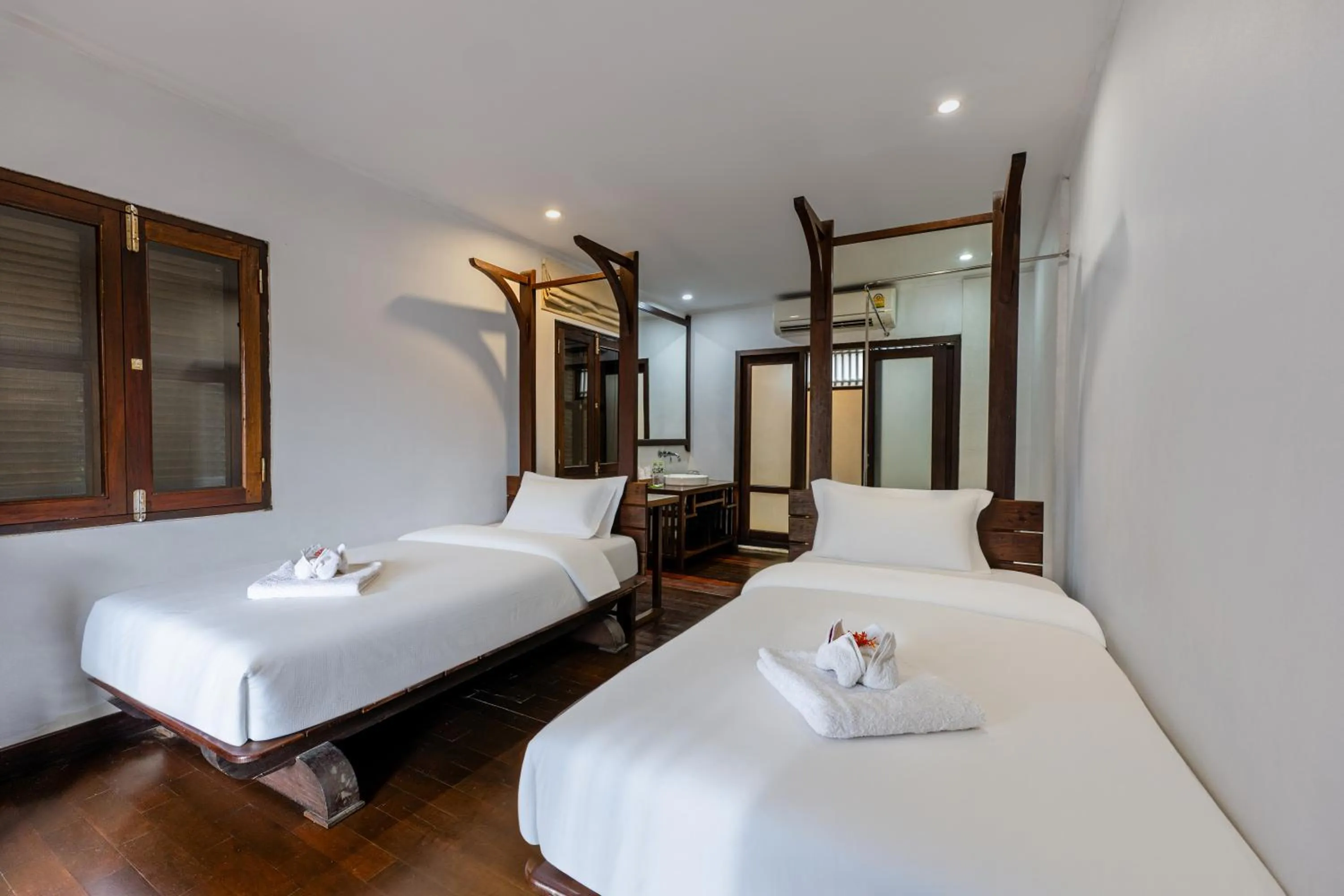 Bed in Ancient Luangprabang Hotel