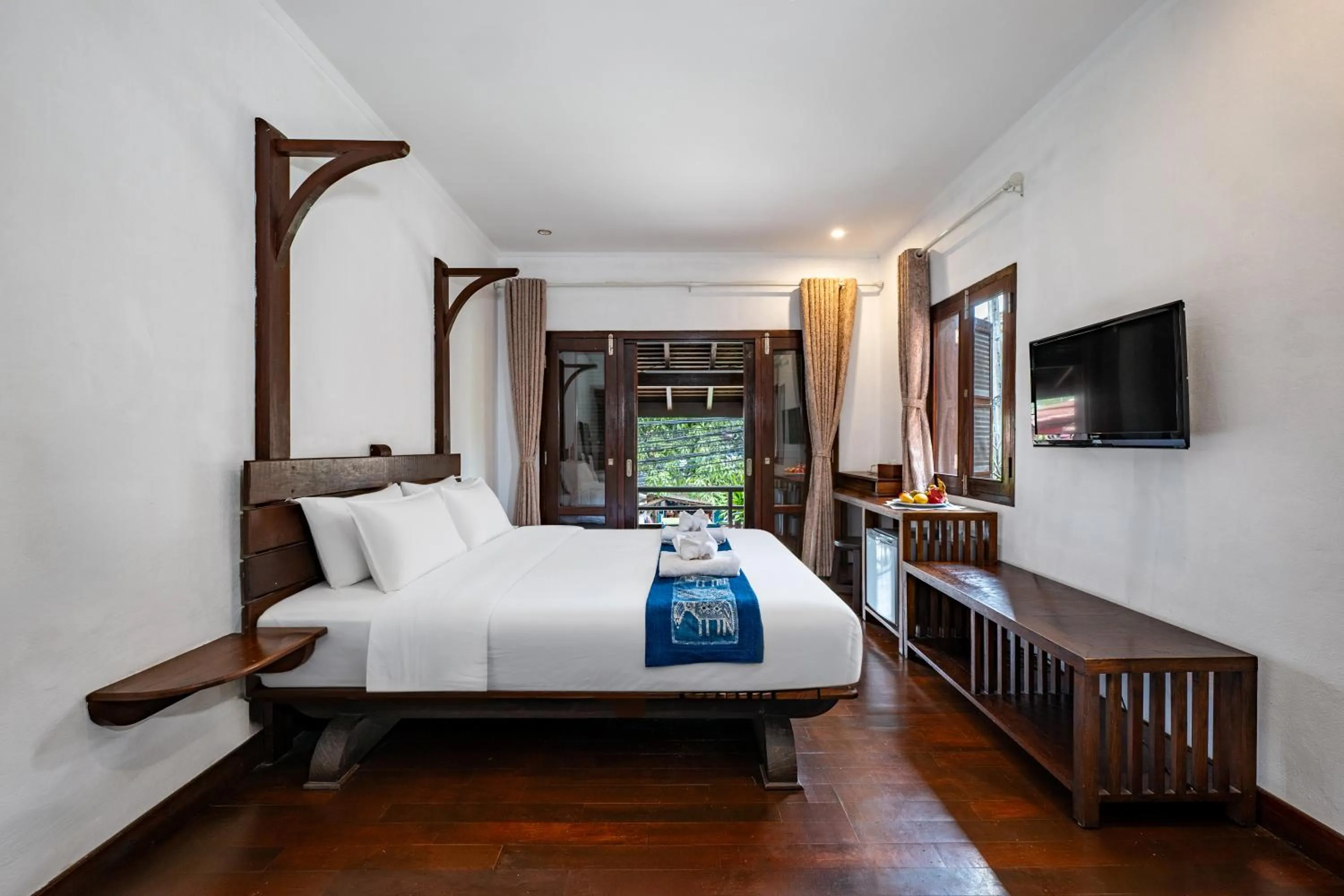 Bed in Ancient Luangprabang Hotel