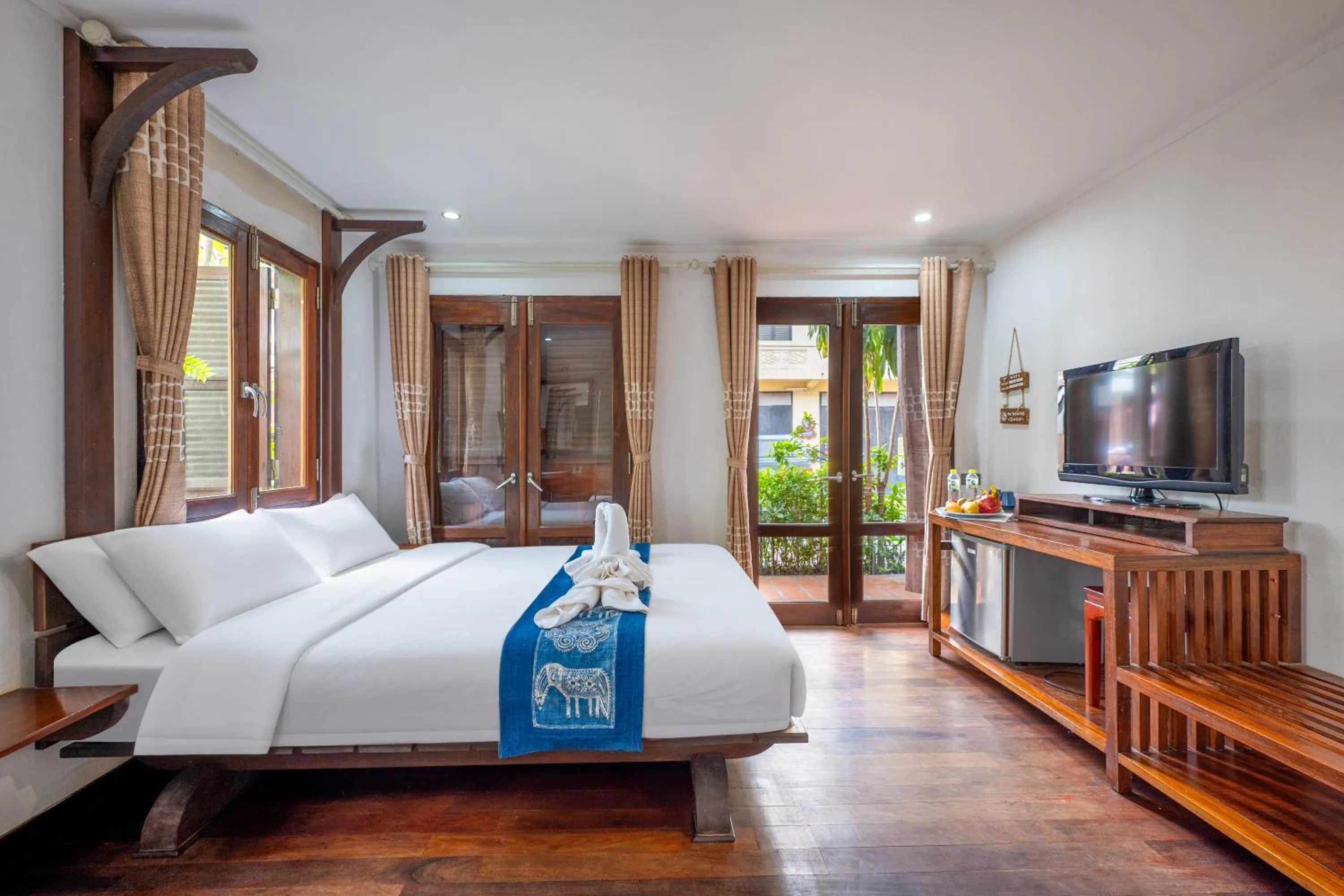 Bed in Ancient Luangprabang Hotel