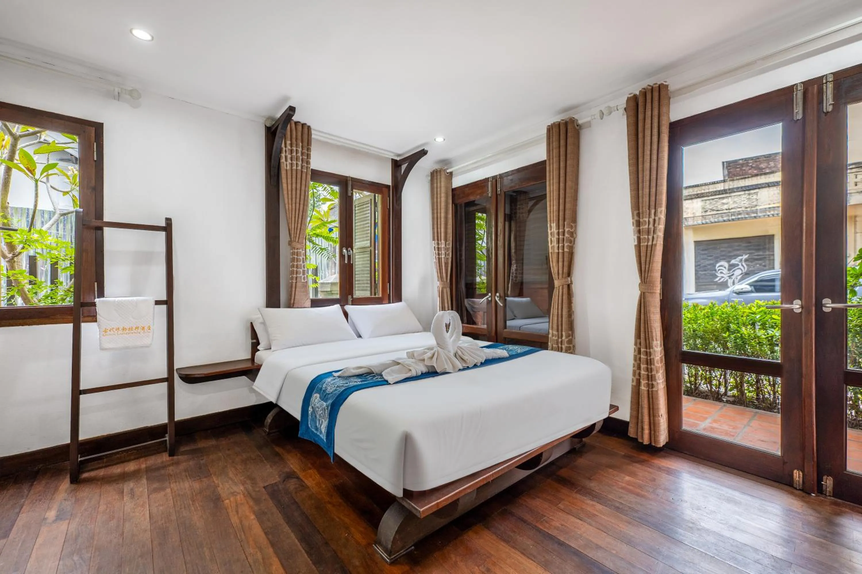 Bed in Ancient Luangprabang Hotel