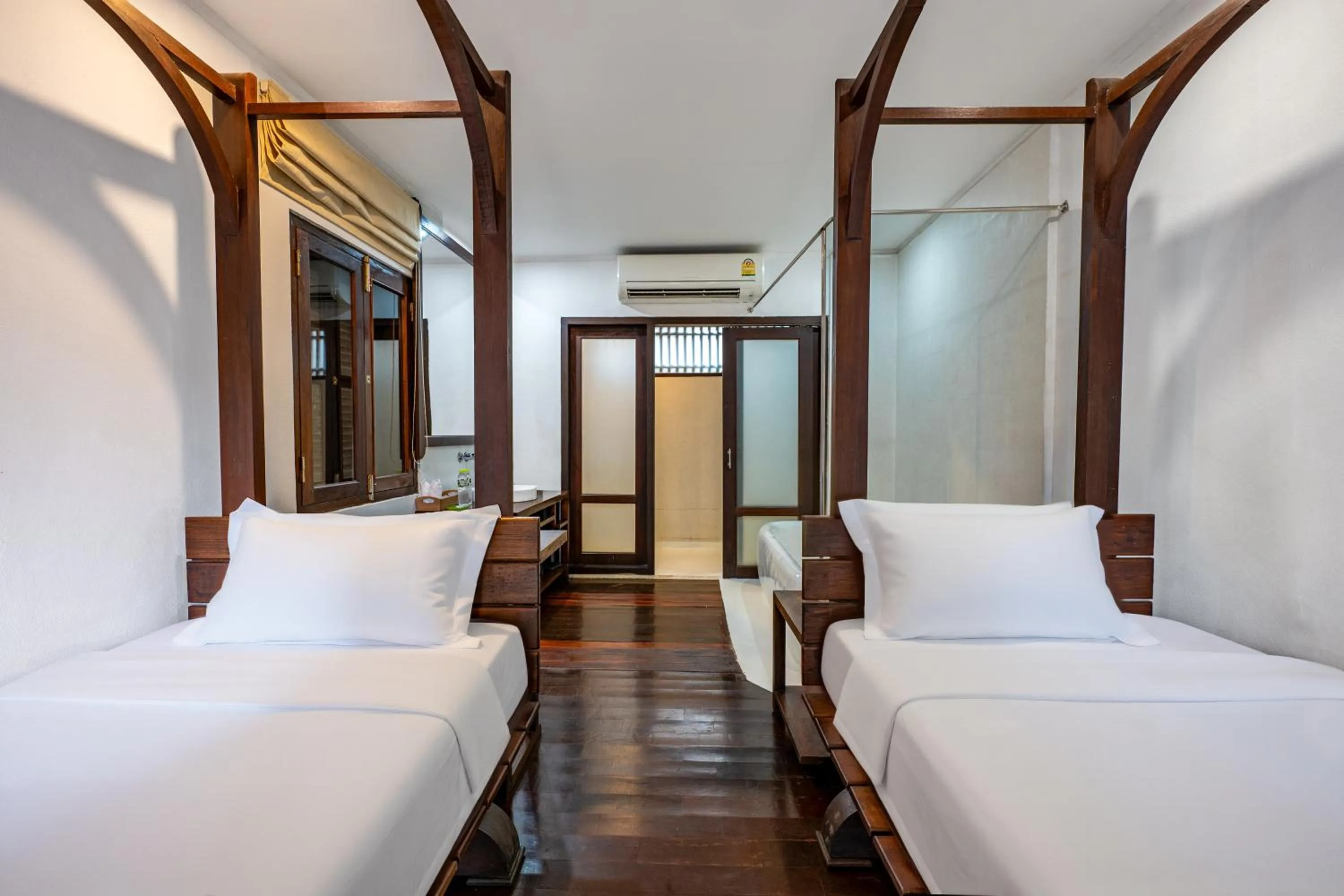 Bed in Ancient Luangprabang Hotel