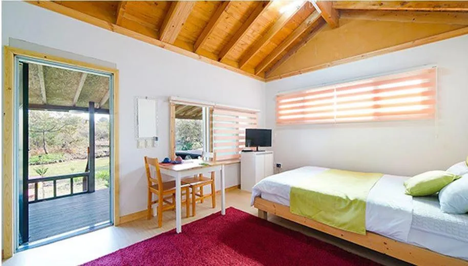 Bed in Gotjawal Geomunoreum Pension