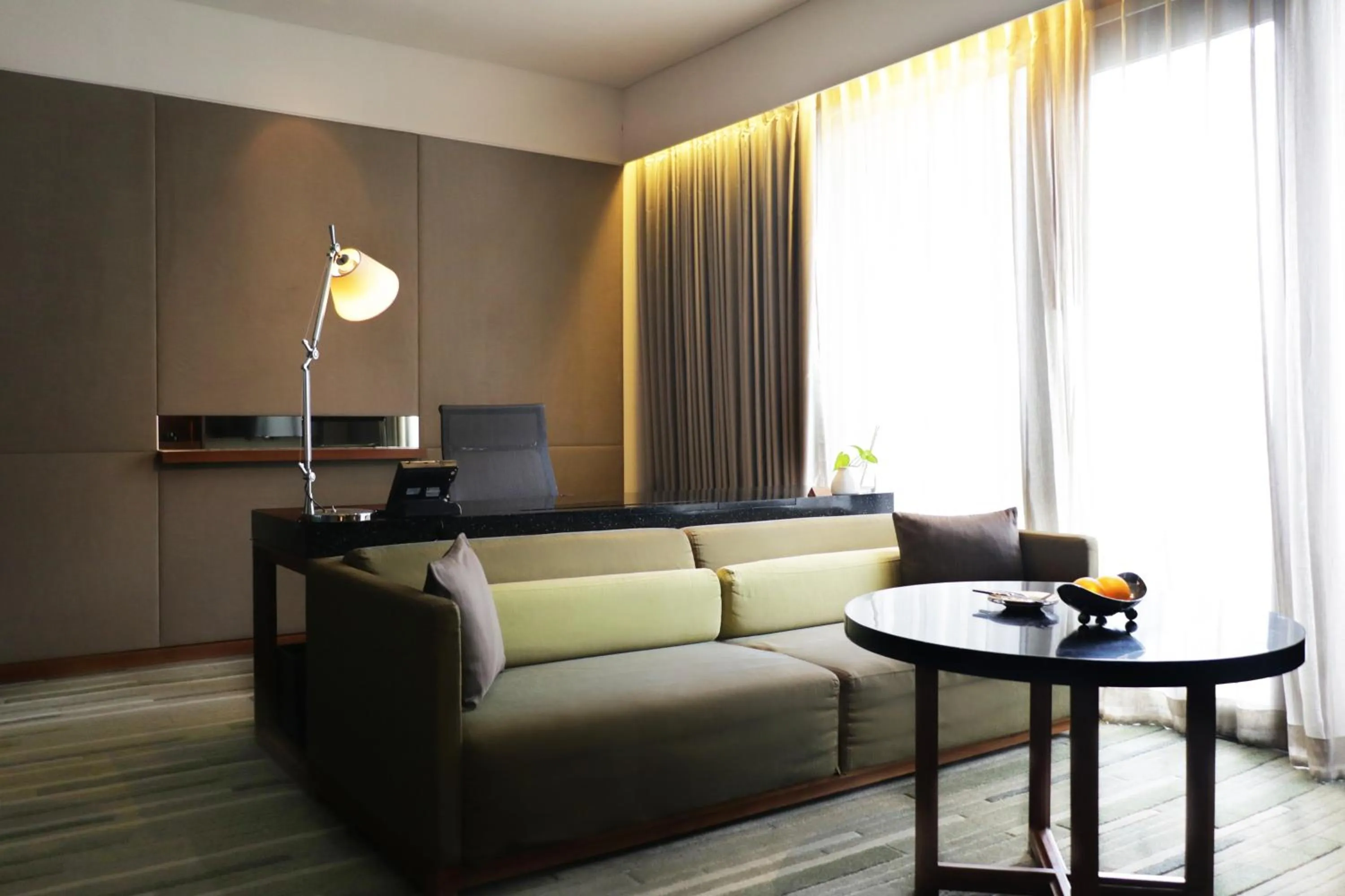 Living room in Hansar Bangkok Hotel