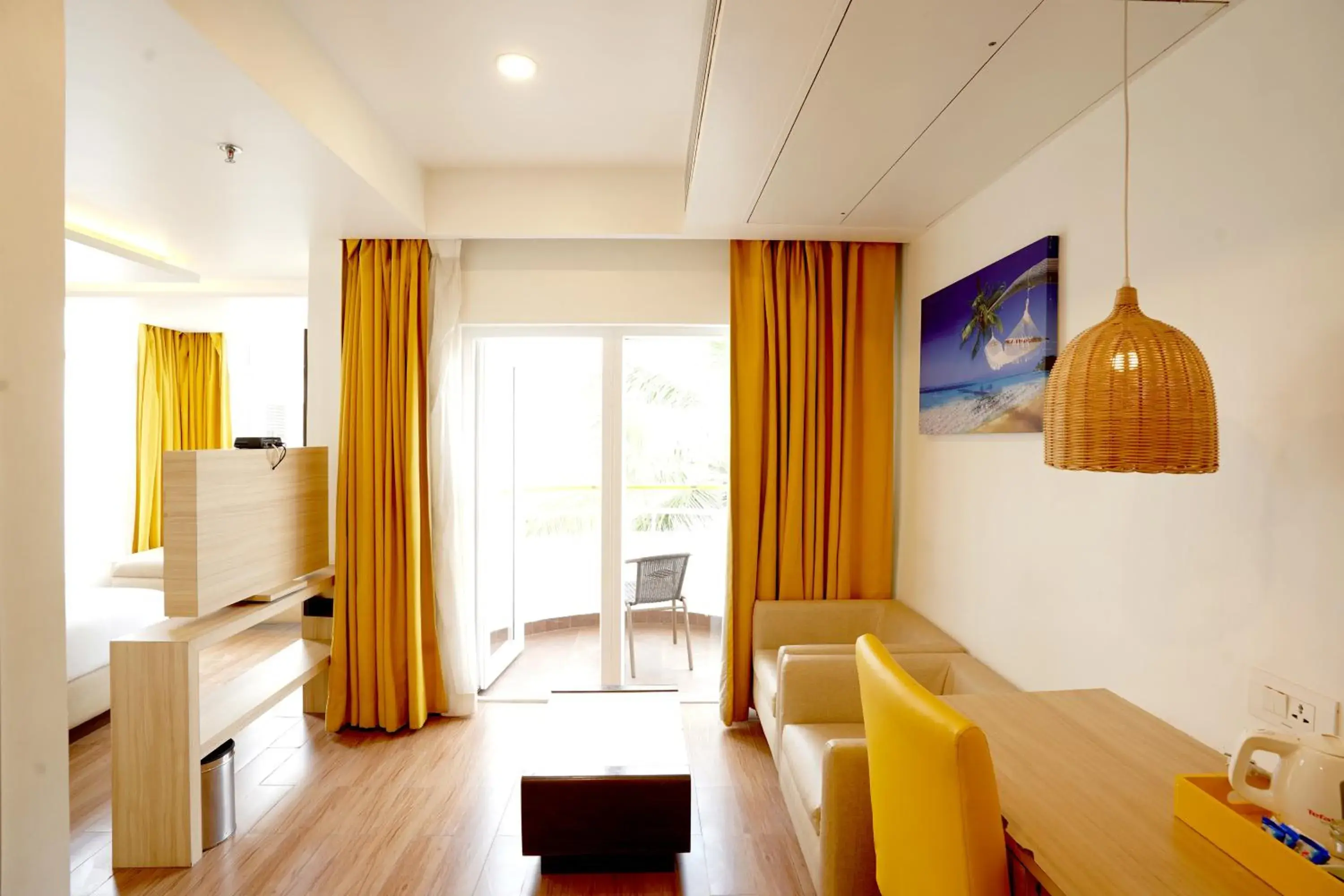 Seating area, Bed in BloomSuites l Calangute Seating area, Bed in BloomSuites l Calangute