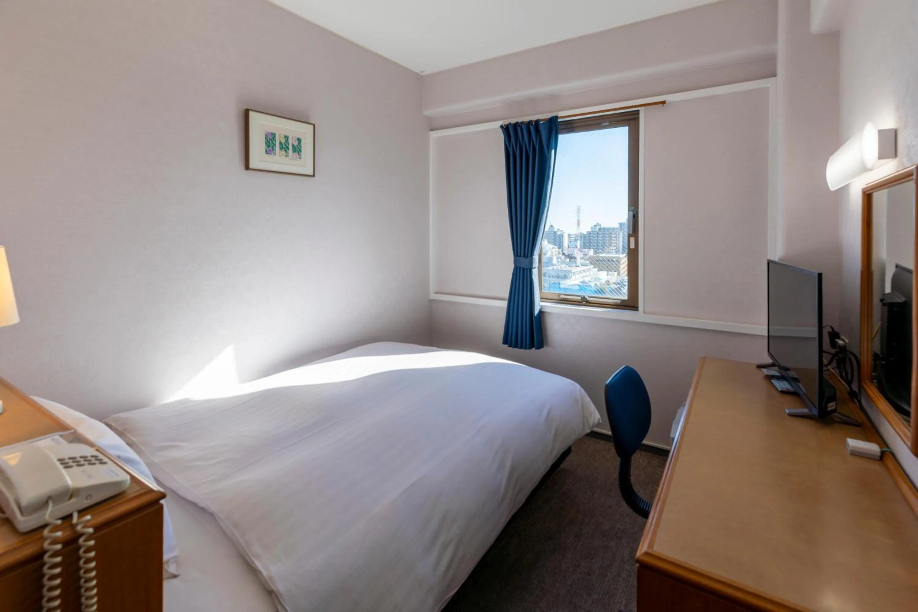 Bed in Hotel New Saitama