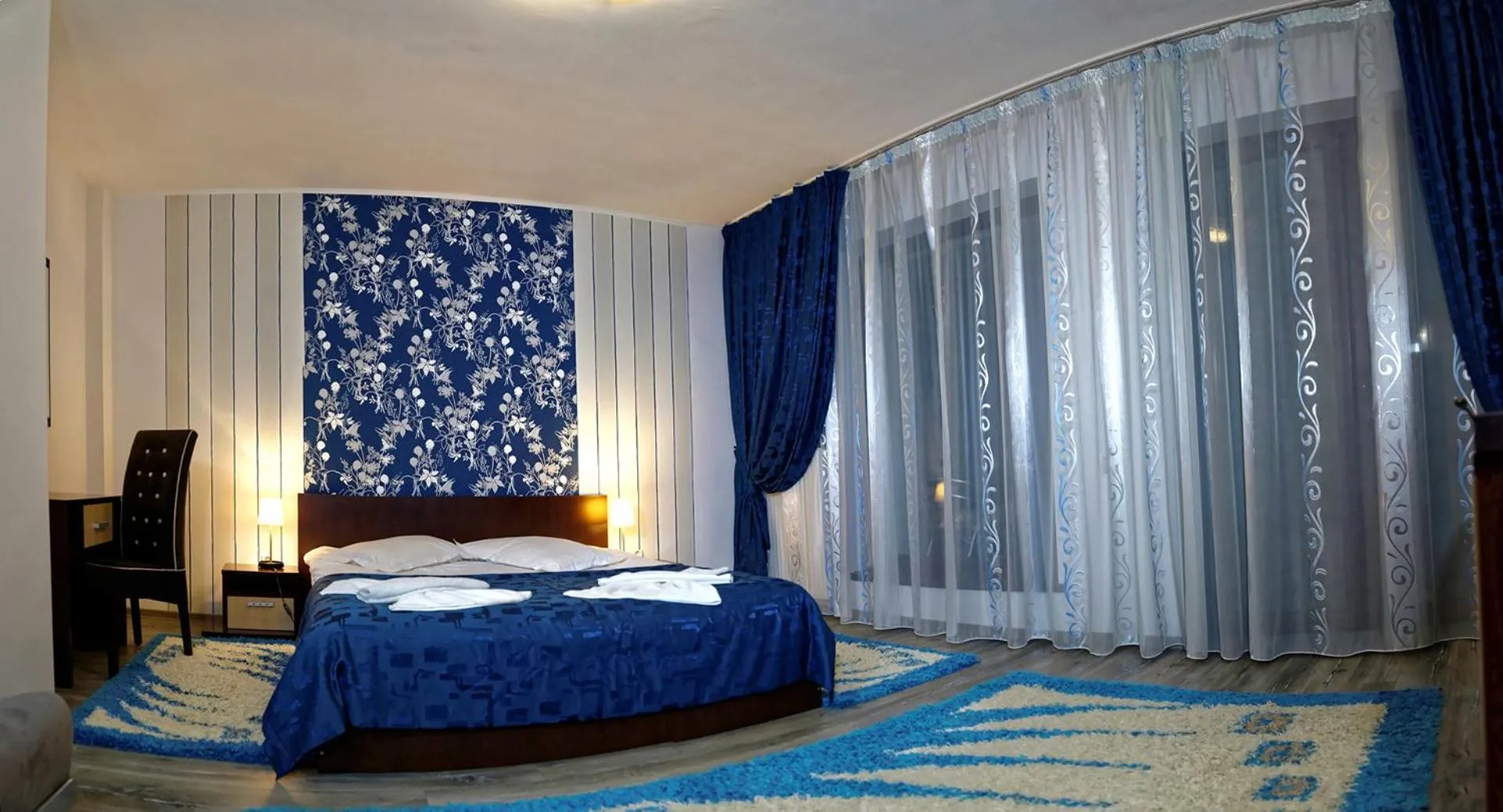 Photo of the whole room, Bed in Hotel boutique Garden Resort by Brancoveanu