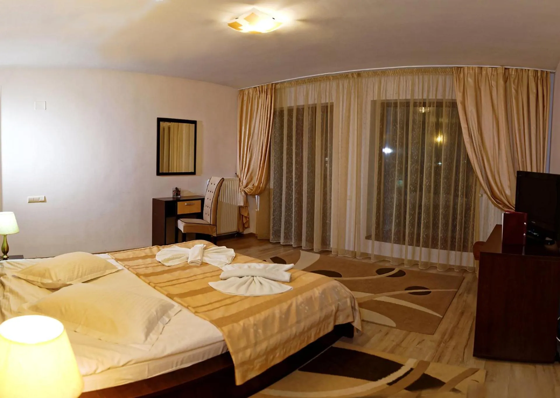 Photo of the whole room, Bed in Hotel boutique Garden Resort by Brancoveanu