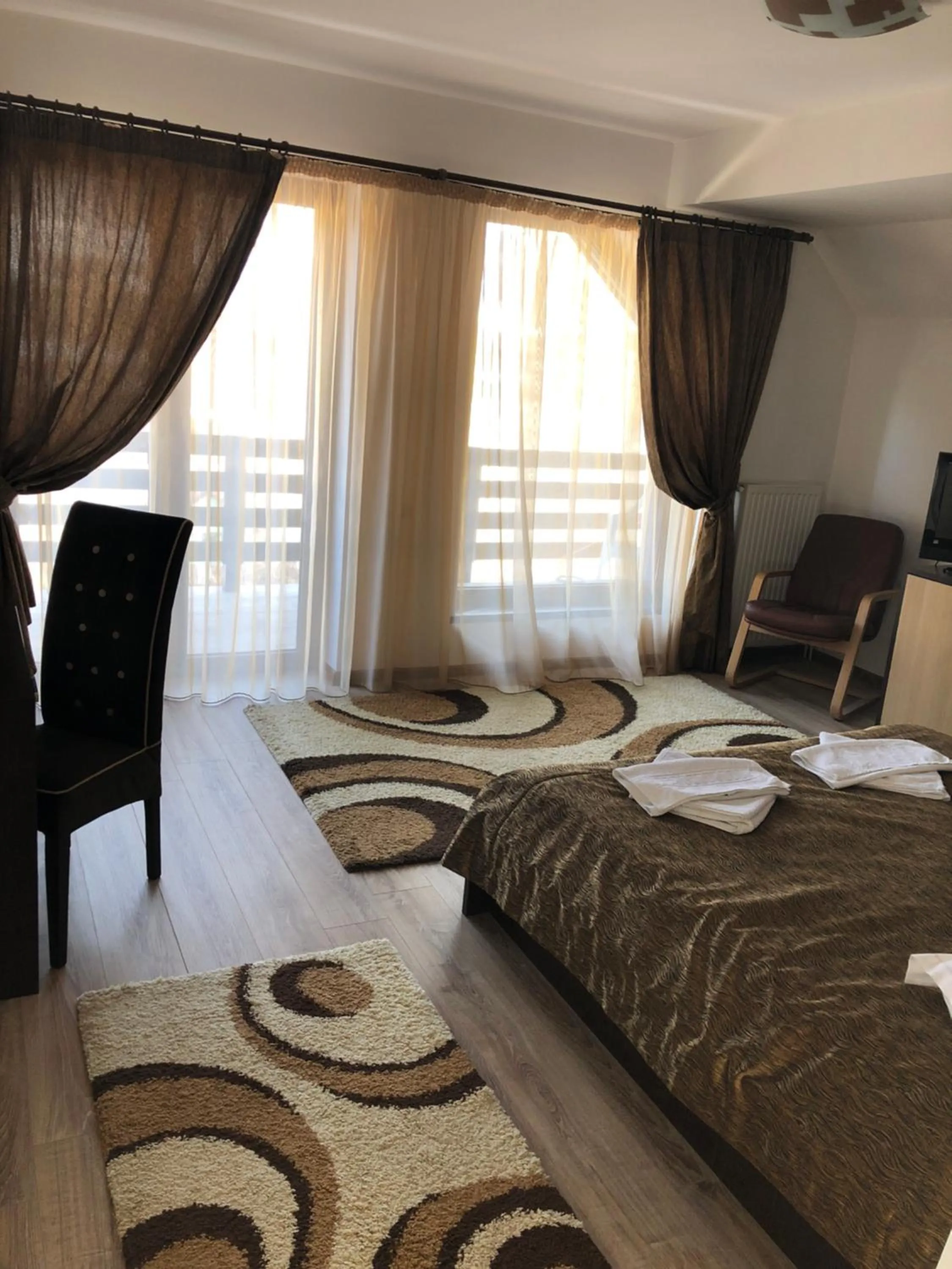 Photo of the whole room, Bed in Hotel boutique Garden Resort by Brancoveanu