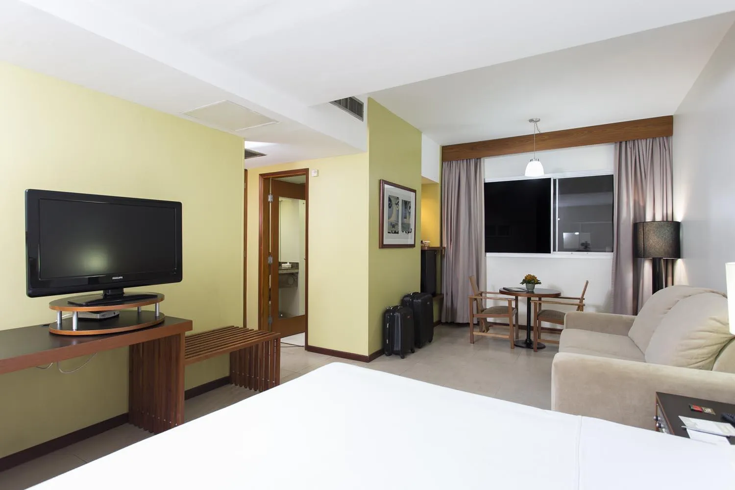 Bed in Black Stream Hotel